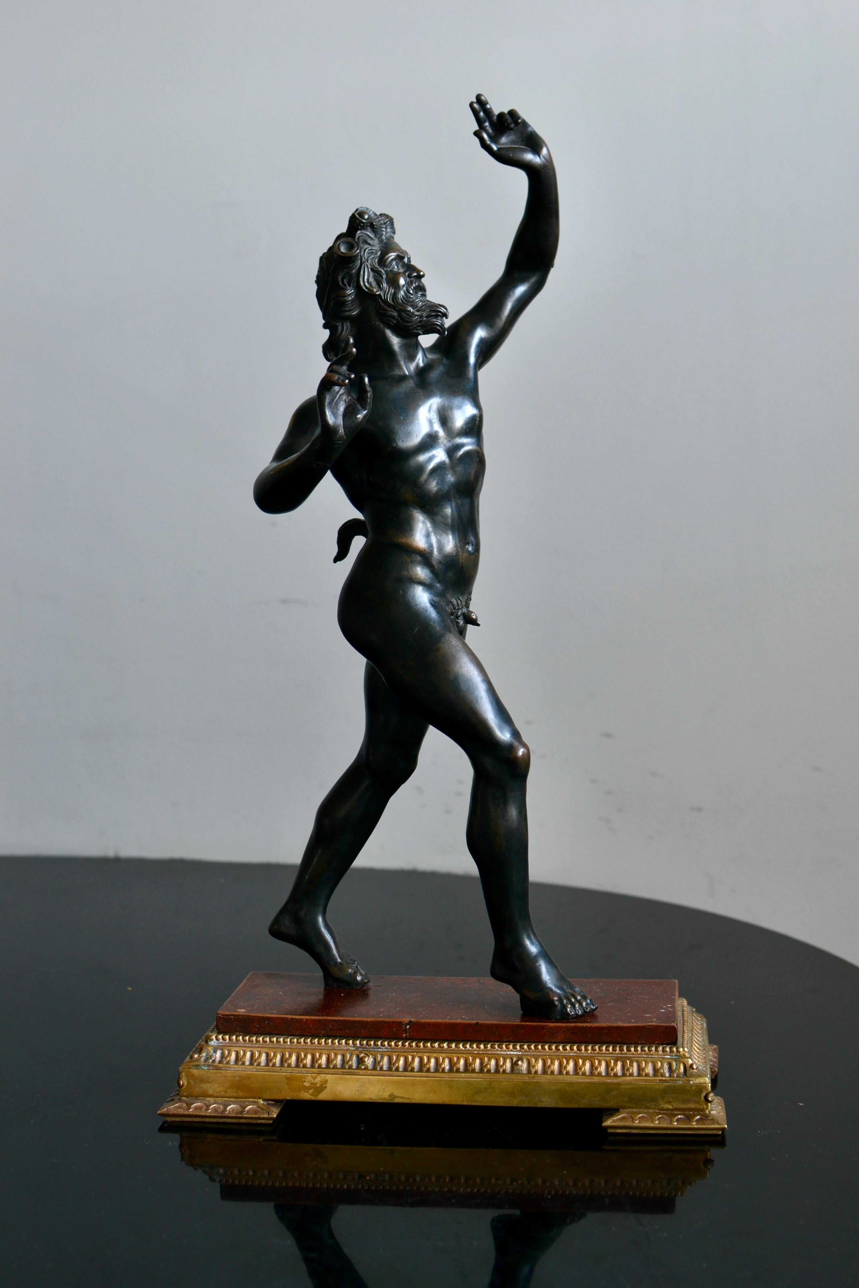 A finely cast Grand Tour bronze sculpture of The Dancing Faun or Il Fauno Danzante. On a gilt-bronze base. With a nice and beautiful surface patina.

The Dancing Faun was discovered in 1830 in the ruins of the most impressive and opulent Roman home