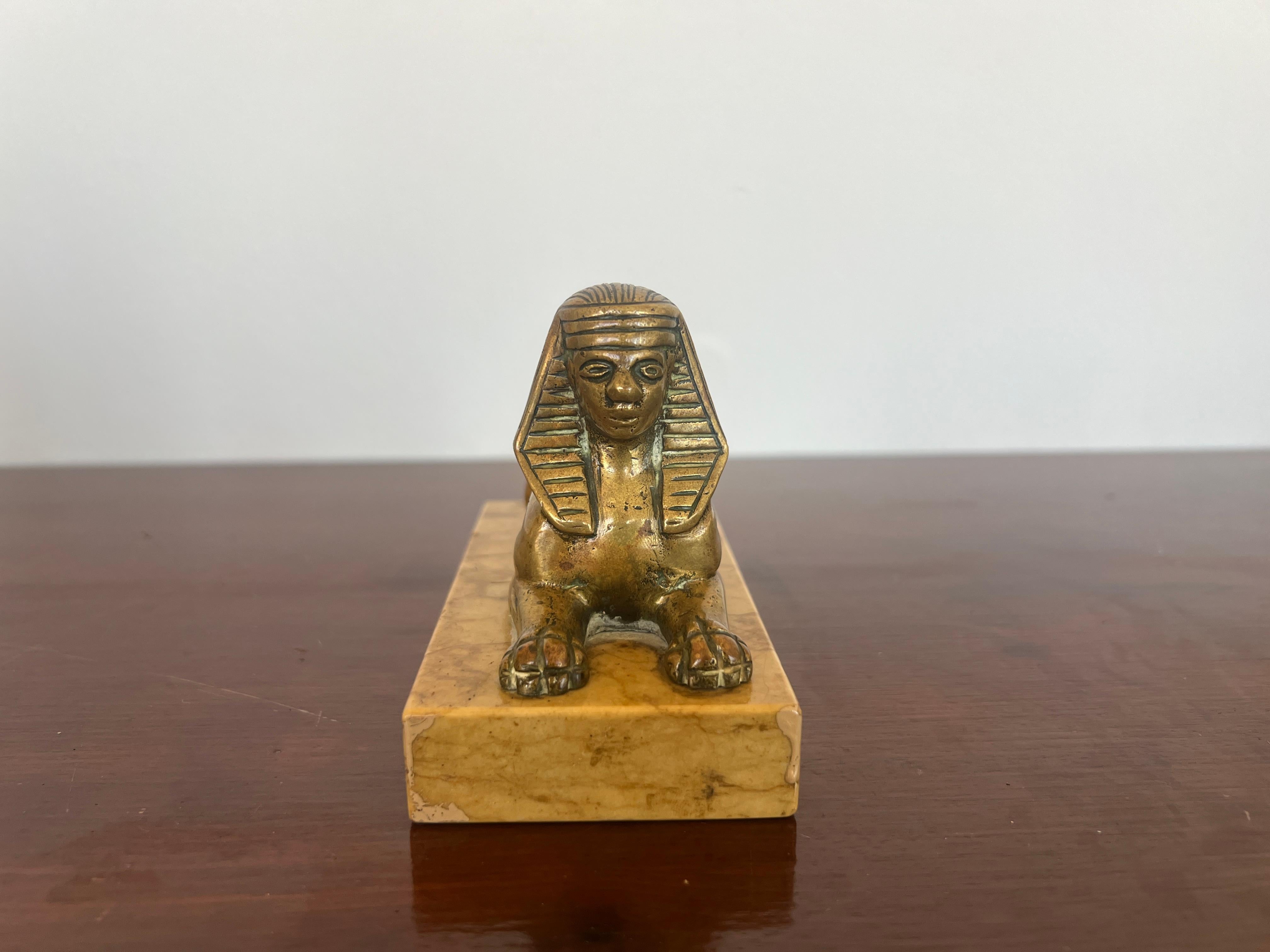 French or Italian, circa late 19th century.

An antique Grand Tour era bronze sculpture of an Egyptian sphinx in the Egyptian revival taste. Mounted to the original sienna marble base. Unmarked.