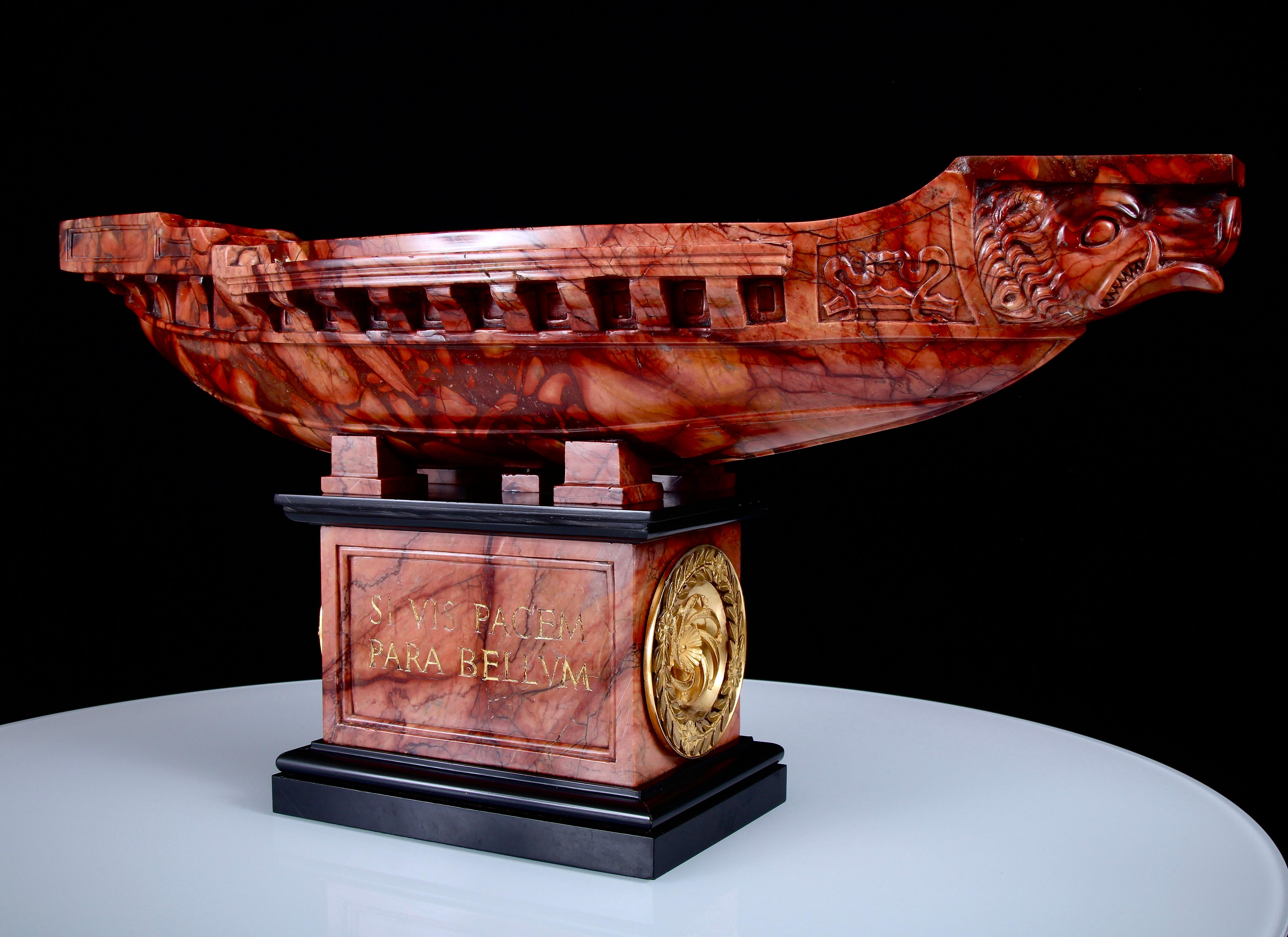 Sculpted from one of the rarest and most visually stunning coloured and figured of stones.
 
Exceptionally Rare 19th Century Carved Breche Sanguine & Gilt Bronze Mounted Navicella. This magnificent marble masterpiece is a work of art, a variation on
