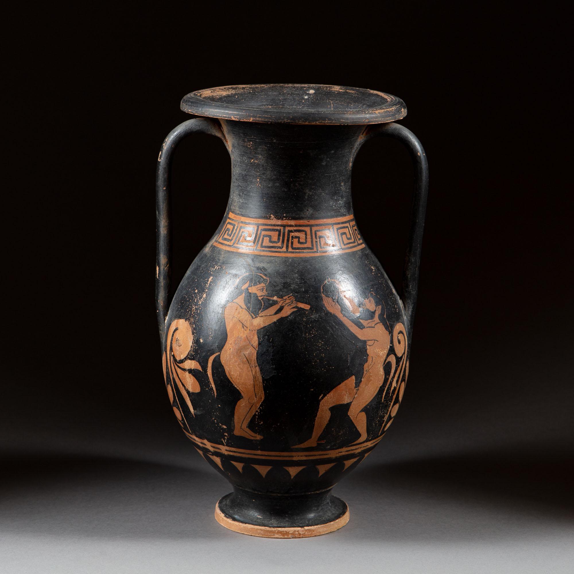 A late 19th century Grand Tour style terracotta vessel, decorated with Grecian figures and Greek key, with Amphora form and two handles to the neck, now as a lamp.

(Please note: dimensions approximate. Will be updated as soon as possible.).