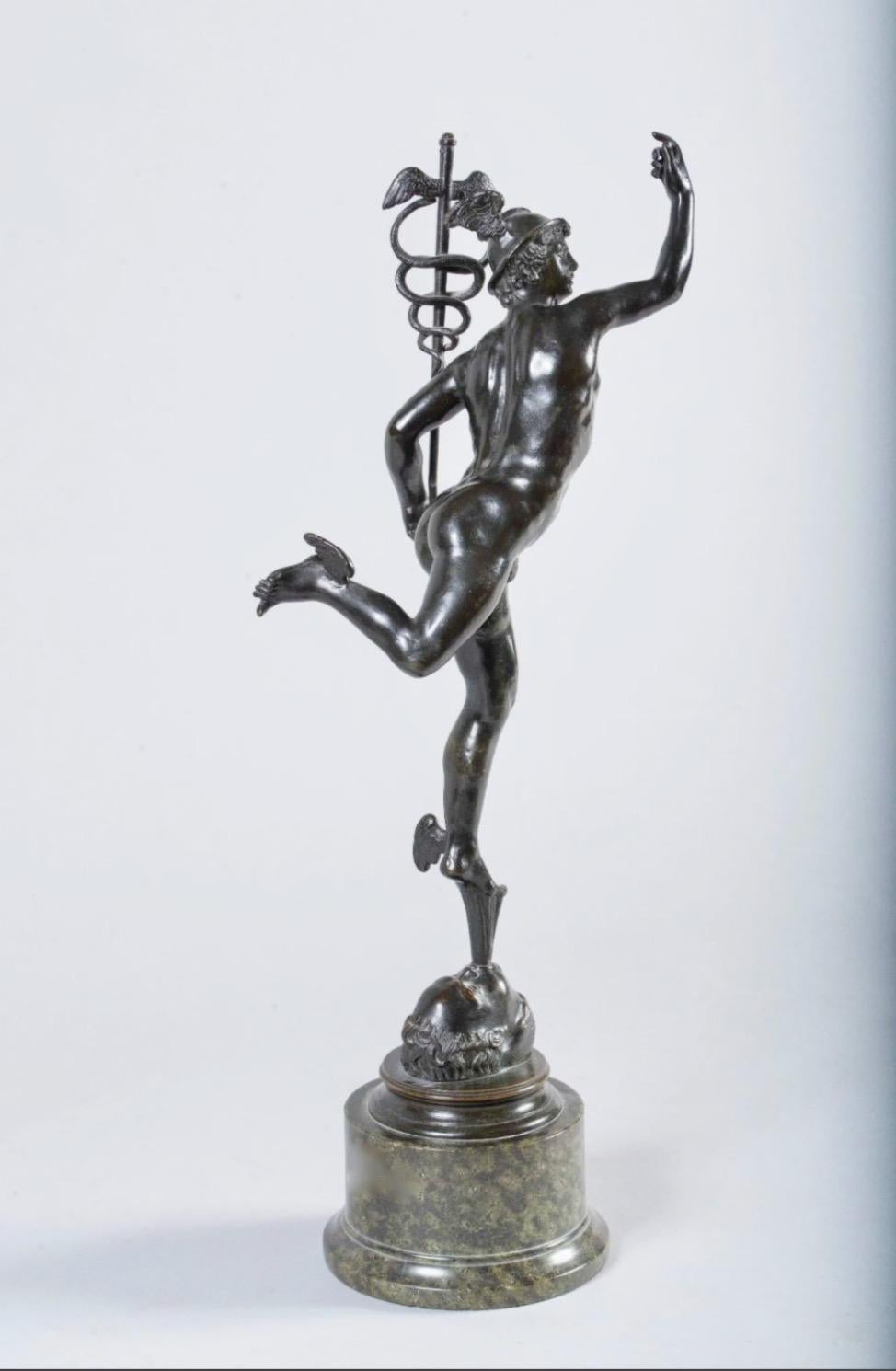 A fine Italian 19th century Grand Tour bronze sculpture of Mercury, also called Mercurius. The bronze have a nice old patina and is in god condition. It is mounted on a round marble base with a grey/greenish color. 
The model of Mercury is after the