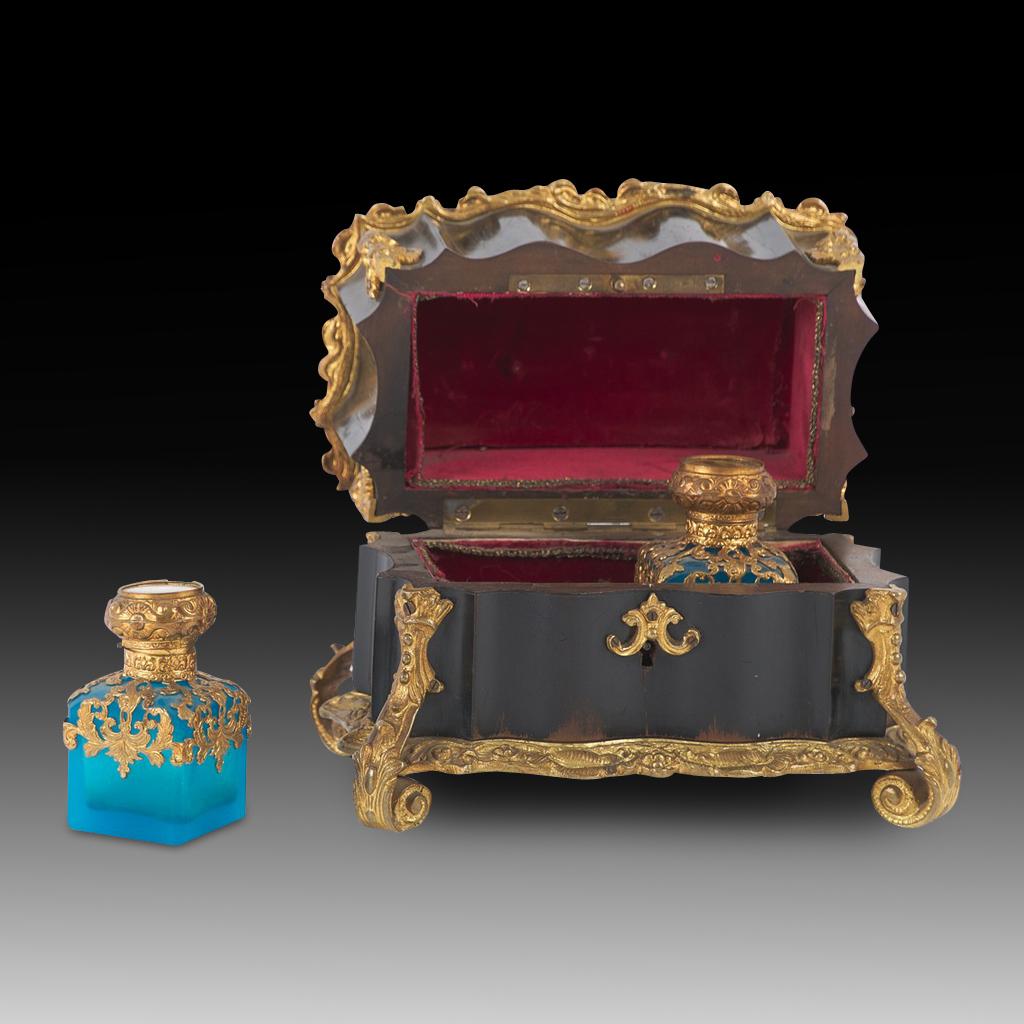 Early 19th Century Grand Tour Souvenirs Palais Royale French Empire Ebonized Fragrance Necessaire with Gold Gilt Bottles & A Sèvres Panel

This is truly an important and stunning piece of Objet d'art. This Sèvres style porcelain necessaire/fragrance