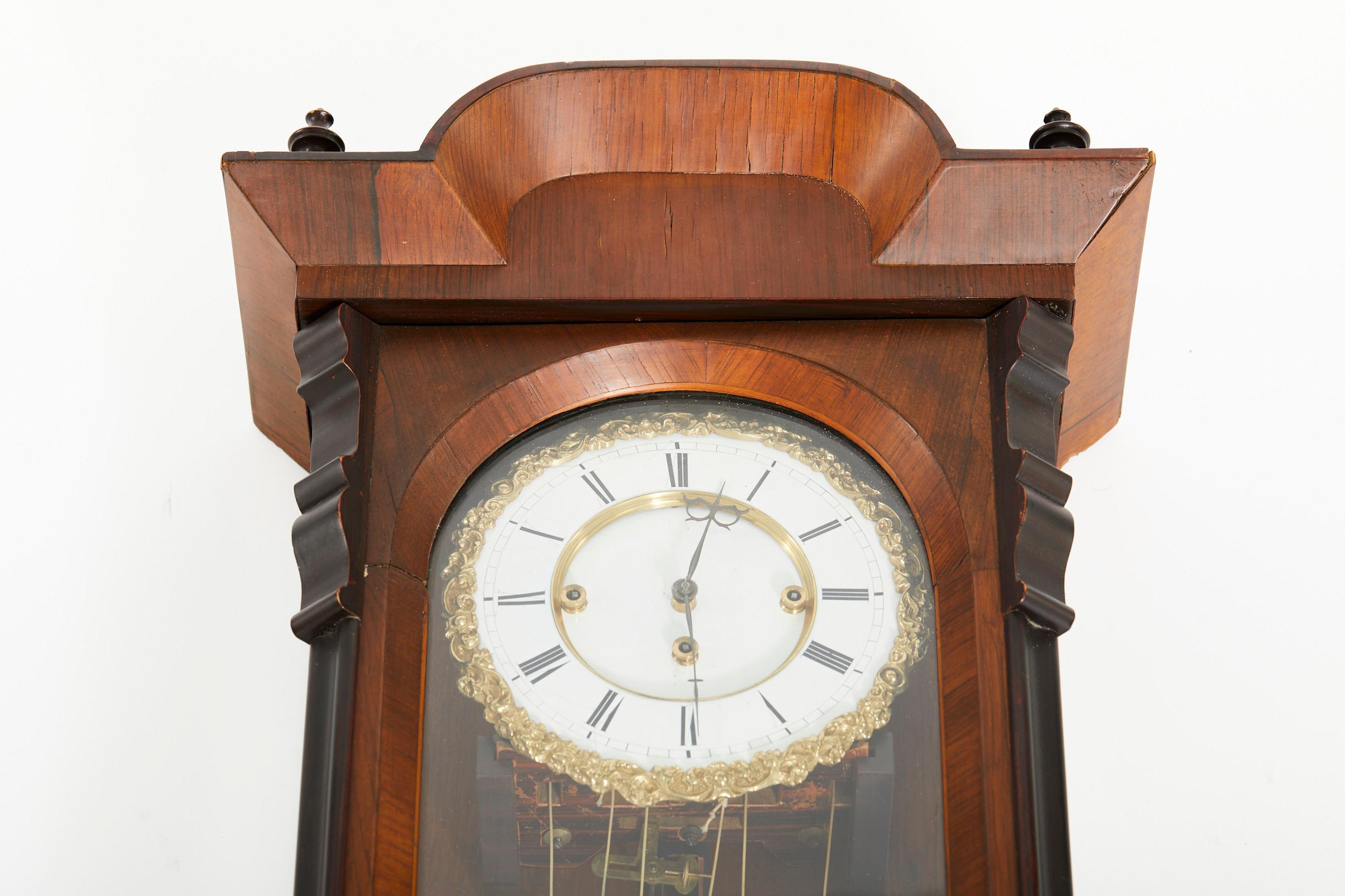 Mid 19th century Mahogany wood / glass case grande Sonnerie three weight Vienna Regulator clock. The wall clock features a rosewood veneer with porcelain dial face having a piecrust brass trim. Eight day 