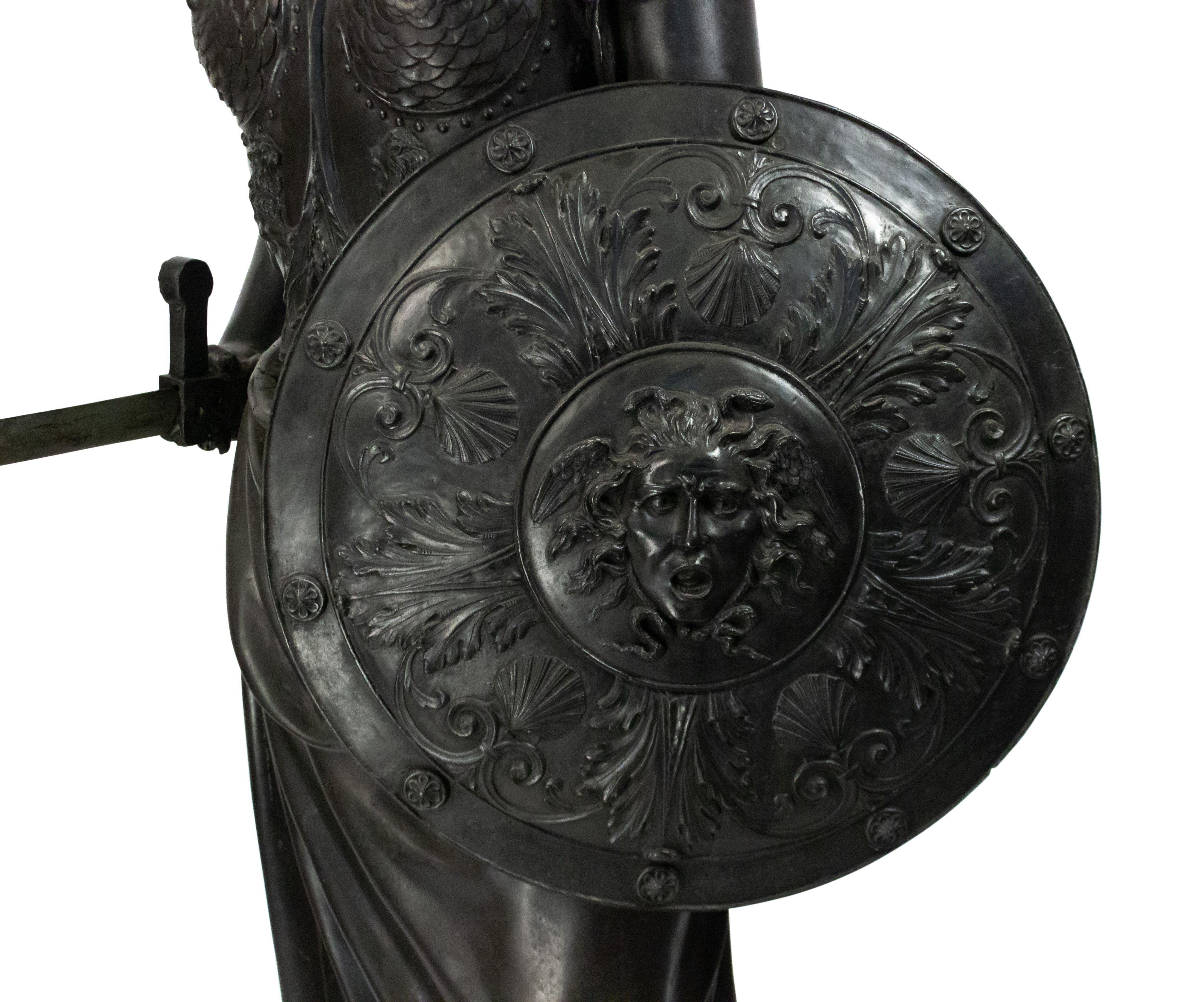 19th Century Grecian-style bronze life-size figure of classic woman with military wardrobe holding a round decorated shield and a sword (sword replaced with wooden model).
