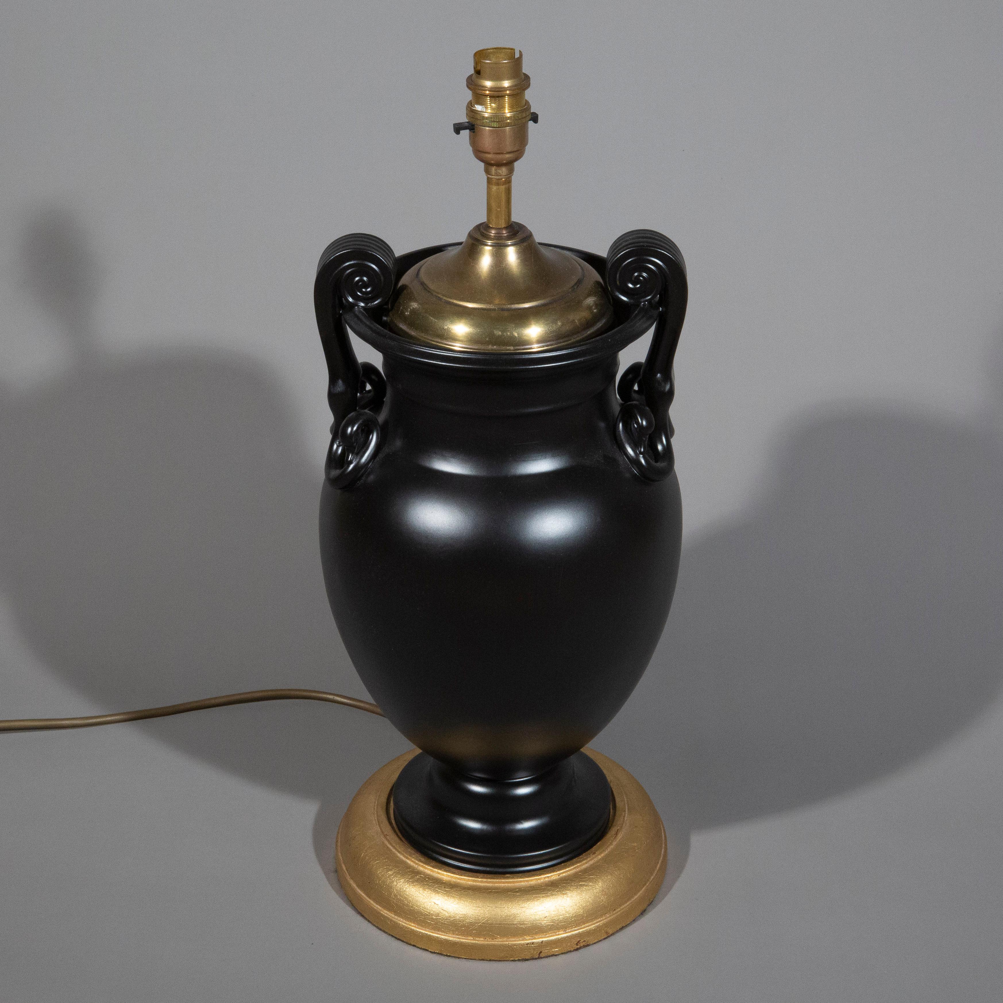 An elegant and rare 19th century Grand Tour black painted ceramic krater vase, inspired by Ancient Greek designs, now expertly mounted as a table lamp. The vase is of a striking volute krater form, offering a refined addition to any interior. A