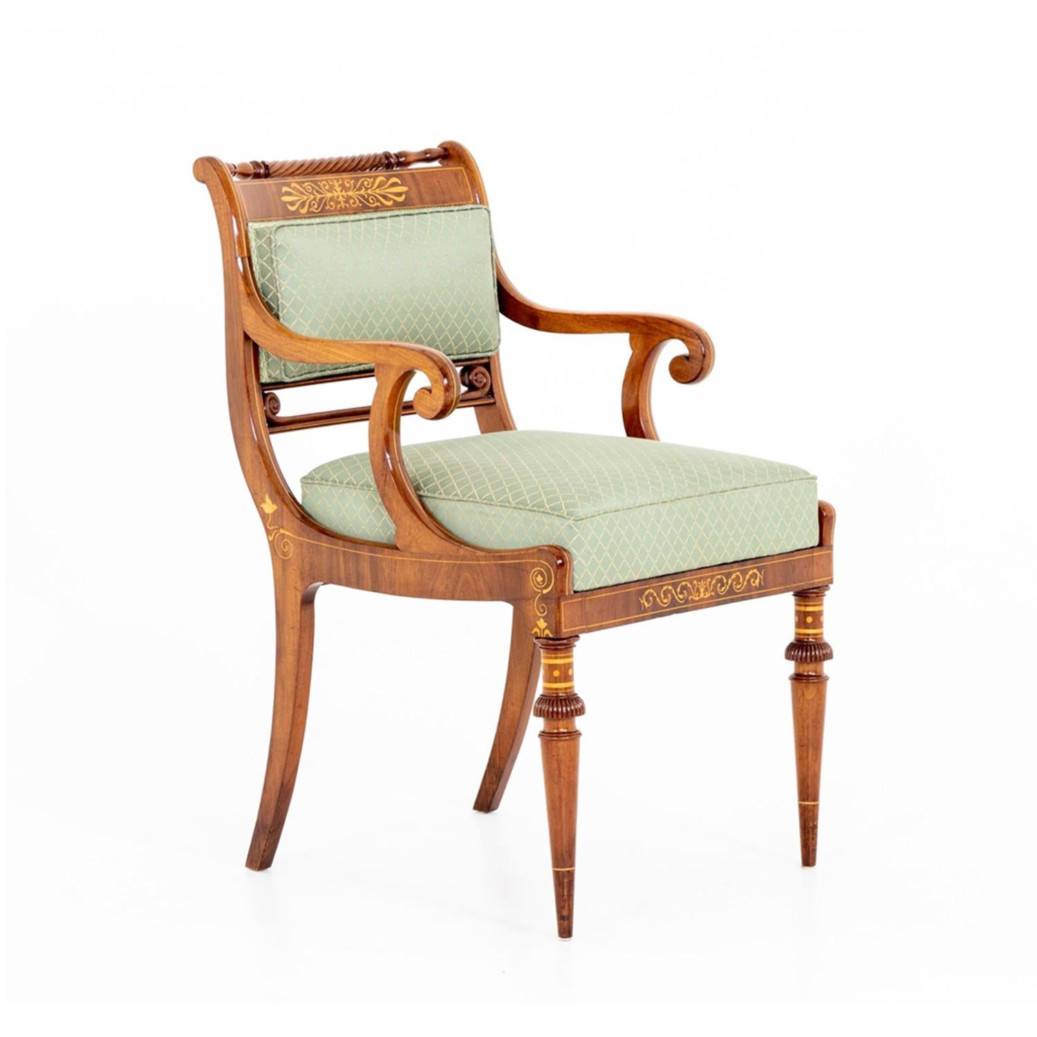 A light-brown, antique Biedermeier German single armchair made of hand crafted shellac polished Mahogany, the fiber décor is made of Maplewood in good condition. The seat backrest of the center, side chair is slightly inclined with thin arched
