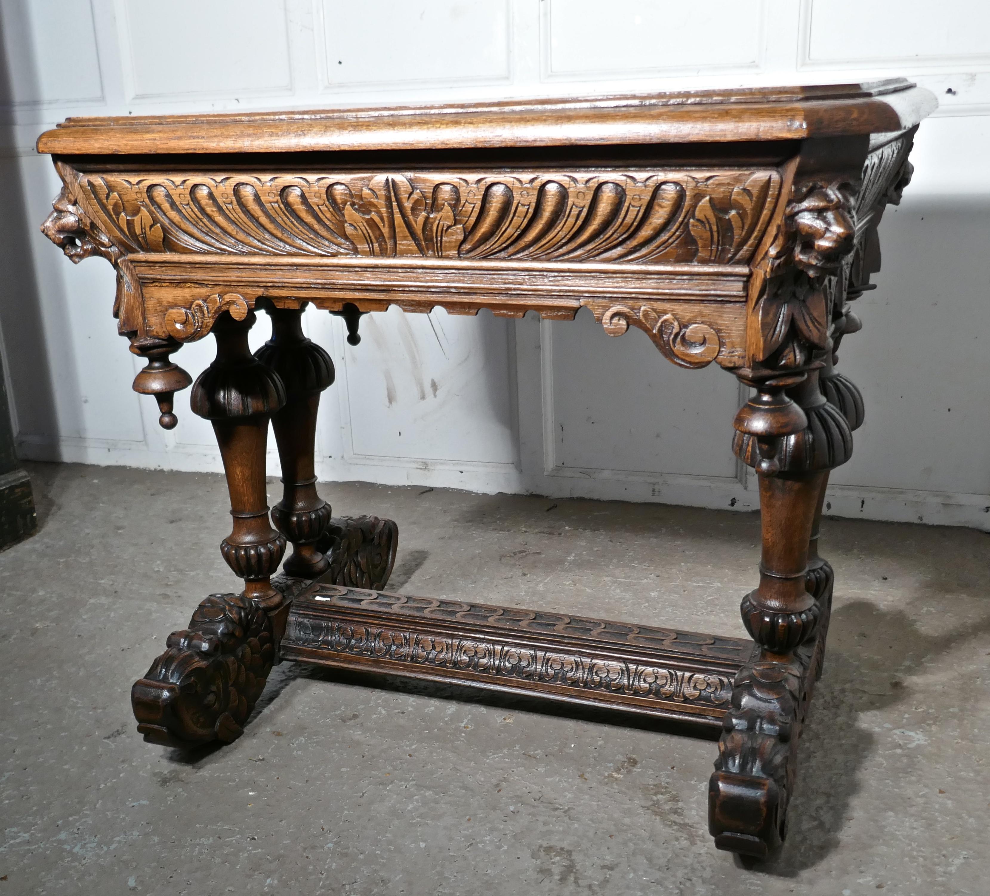 19th century Green Man carved golden oak hall or centre table
 
This is an intricately and very attractive piece, of Gothic carved oak furniture. The quality of this one is superb, the carving is fine and very detailed and the oak has an