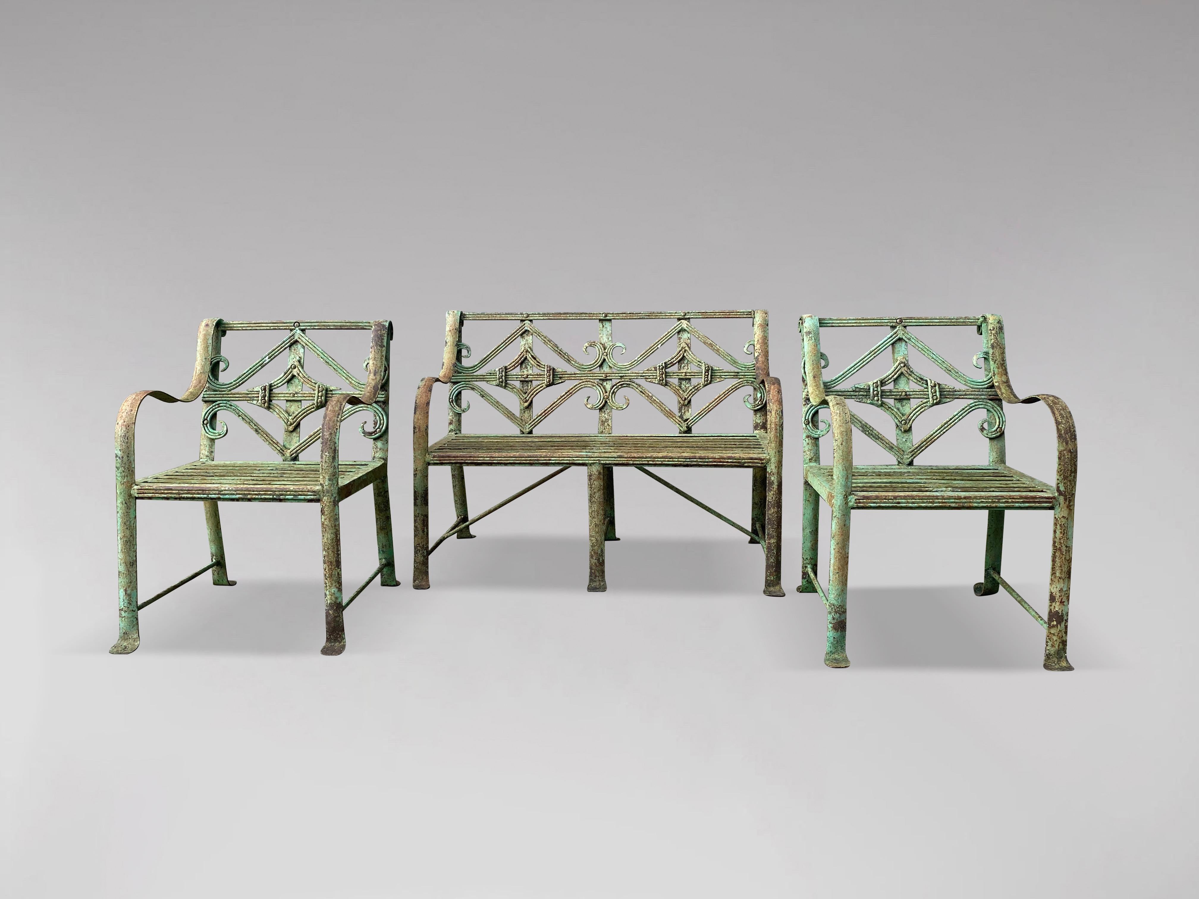 A stunning 19th century green painted wrought iron child's garden suite. Comprising a bench (77cm wide) and a pair of matching open armchairs (39cm wide). Great quality.

The dimensions are:
Height: 56cm (22.0in)
Width: 77cm (30.3in)
Depth: 41cm