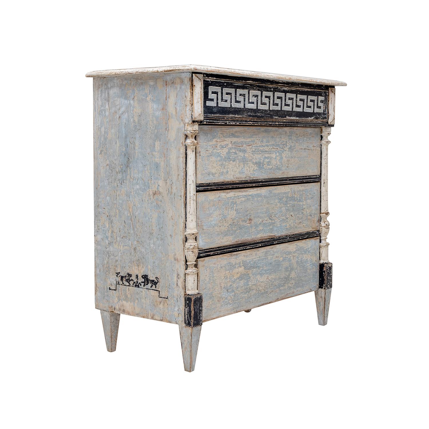 A light-grey, antique Swedish Gustavian single commode made of hand crafted painted Pinewood, in good condition. The Scandinavian cabinet, cupboard is composed with three large drawers, consisting its original metal hardware, enhanced by detailed