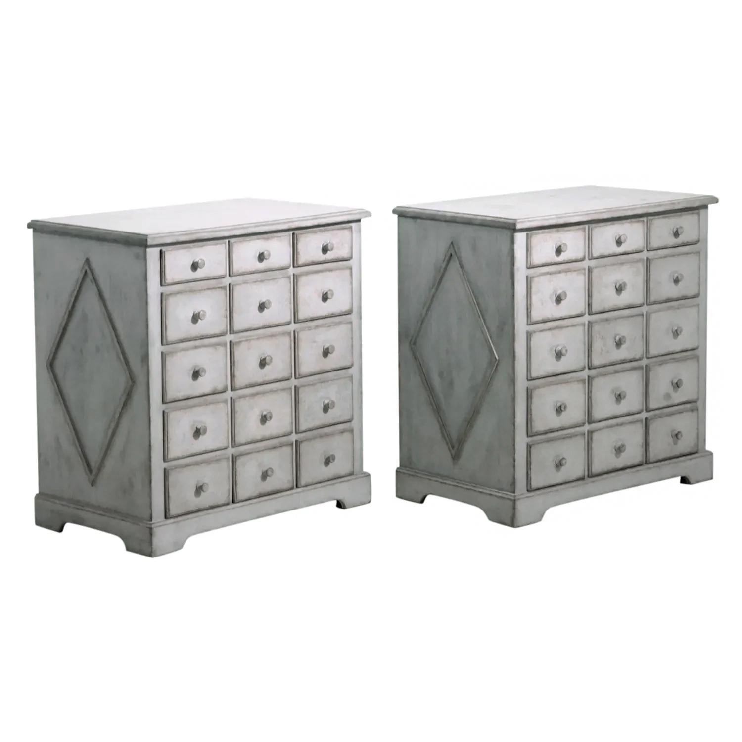 A dark-grey, white antique Swedish Gustavian pair of pharmacy desks made of hand crafted painted Oakwood, in good condition. Each of the Scandinavian apothecary cabinets are composed with fifteen drawers with round wooden pulls, supported by four