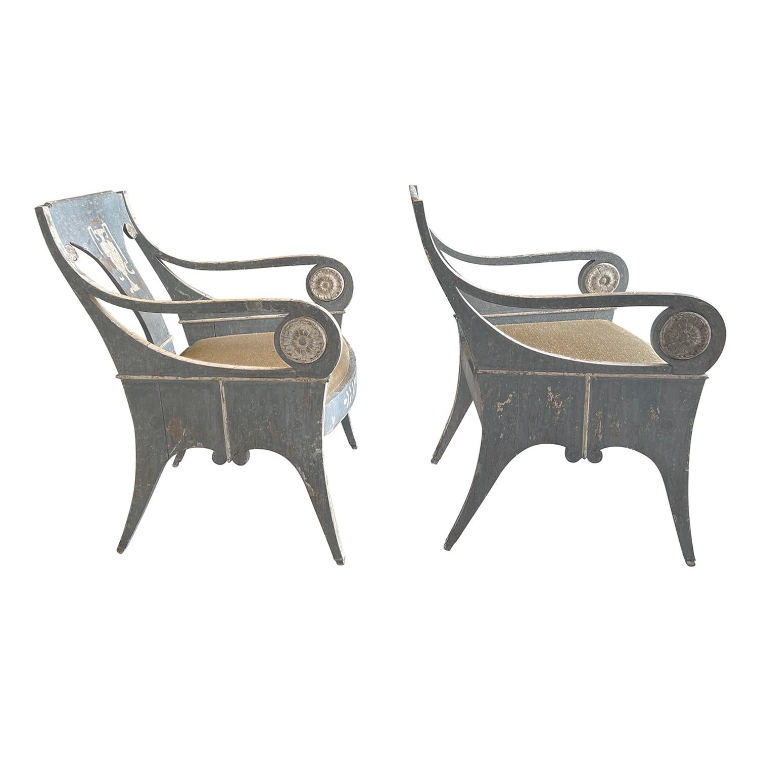 A pair of rare 19th century Swedish Gustavian fauteuils or armchairs made of handcrafted pinewood, patinated in a grey white finish with a hand painted white Greek Amphora urn hand painted onto the backrest and floral décor on the front of the seat,