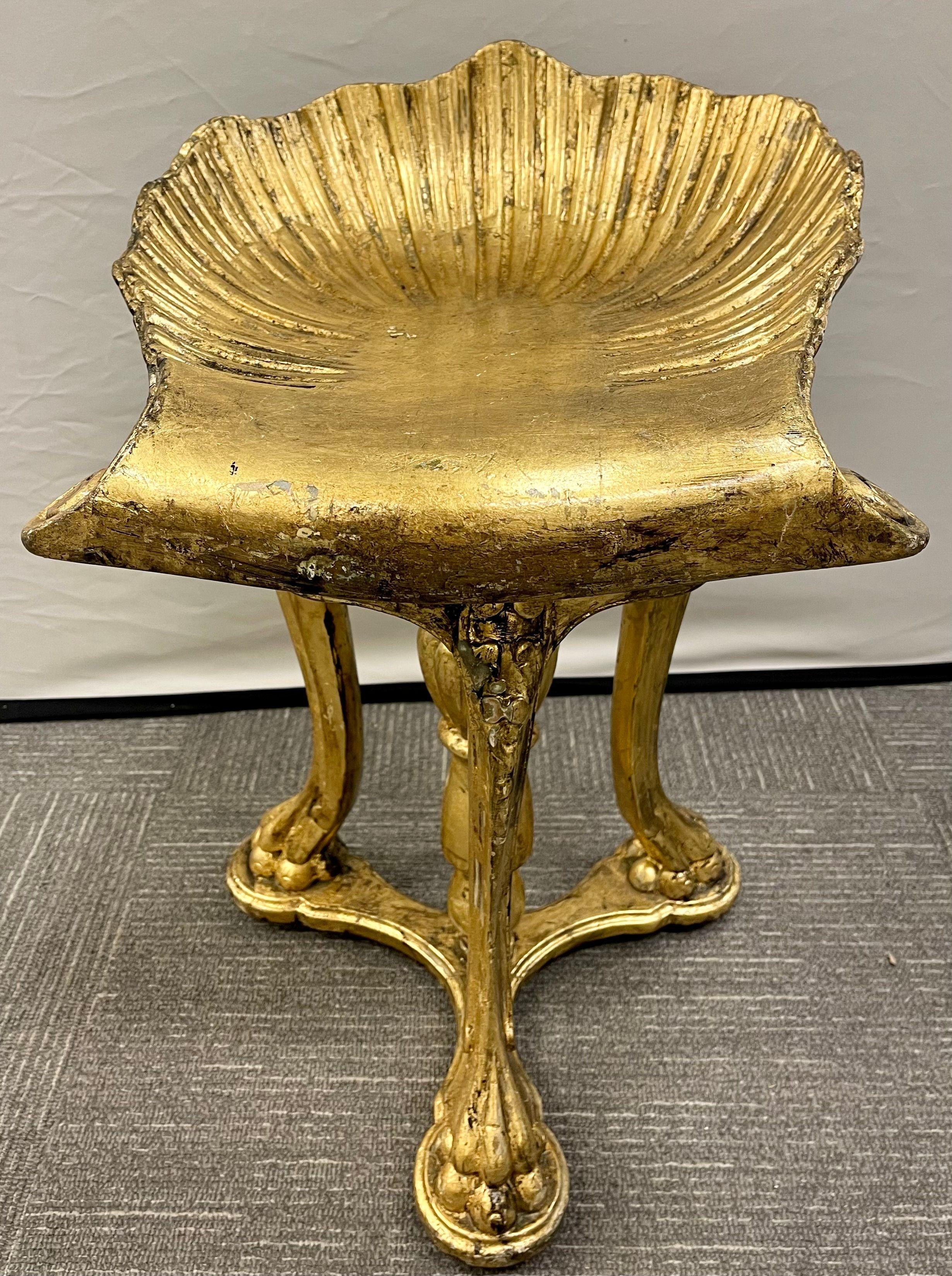 A Fine Grotto stool or Piano bench. This one of a kind bench swivels and adjust from 17.5 to 21 inches in seat height. Finely guild gold in form with wonderfully carvings in its untouched original condition. Late 19th century circa Italian Venetian