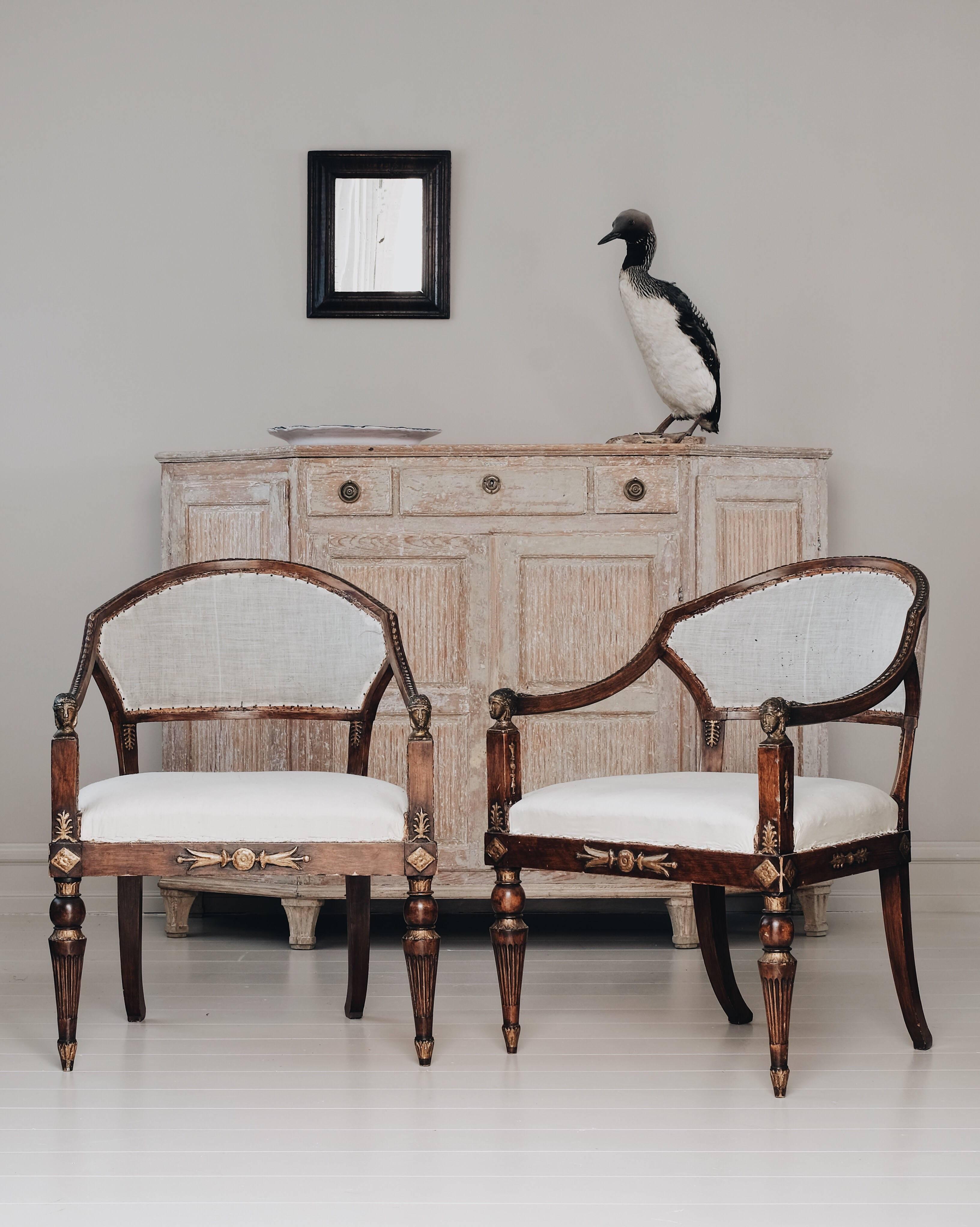 Exceptional pair of late Gustavian armchairs in the Egyptian taste in its original condition, circa 1810. Made in Stockholm by a master chair maker after drawing by architect Carl Christoffer Gjörwell (1766-1837) 

Gjörwell was a city architect in