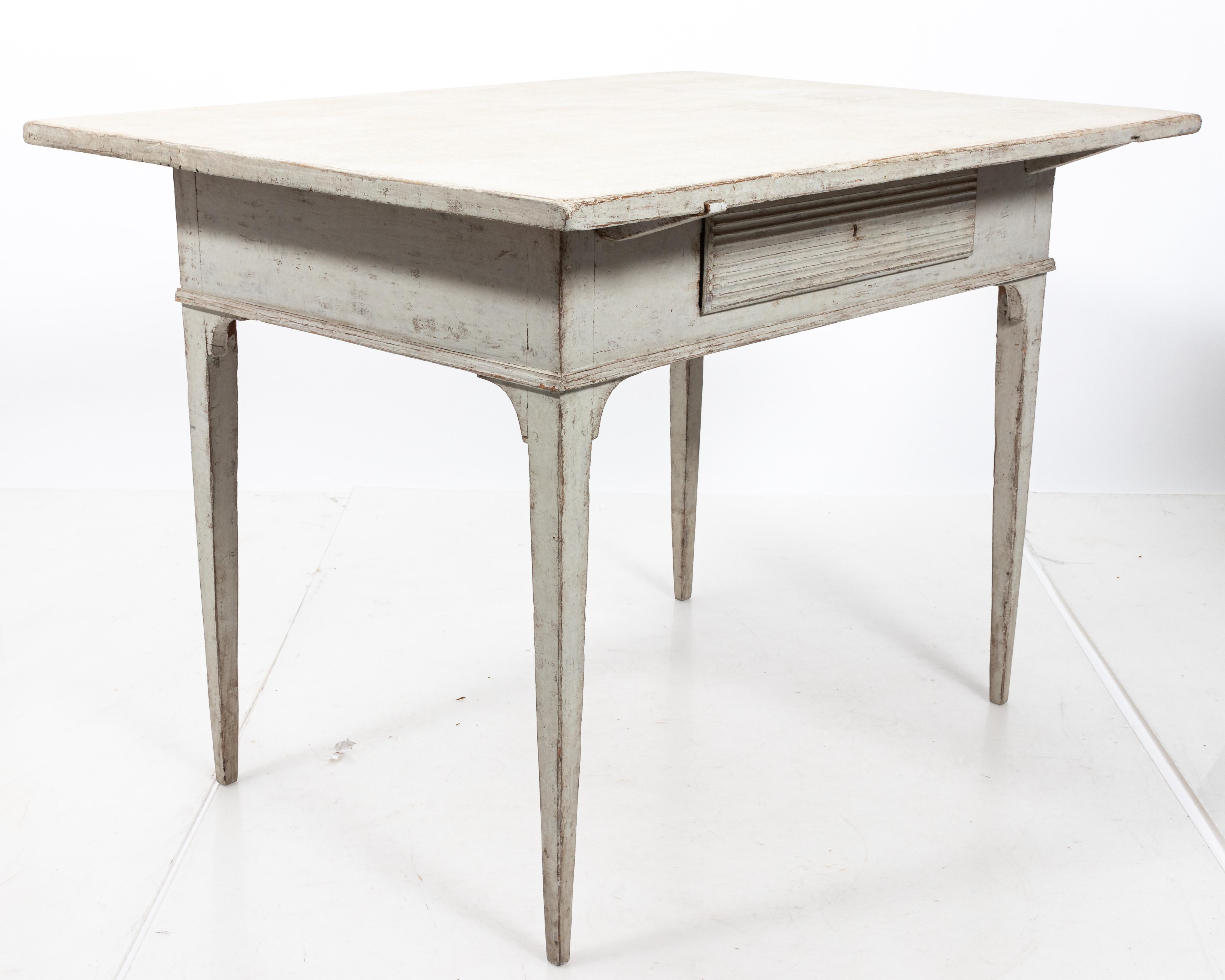 19th century Gustavian side table with a single reeded front drawer. Please note of wear consistent with age including paint loss. Made in Sweden.
