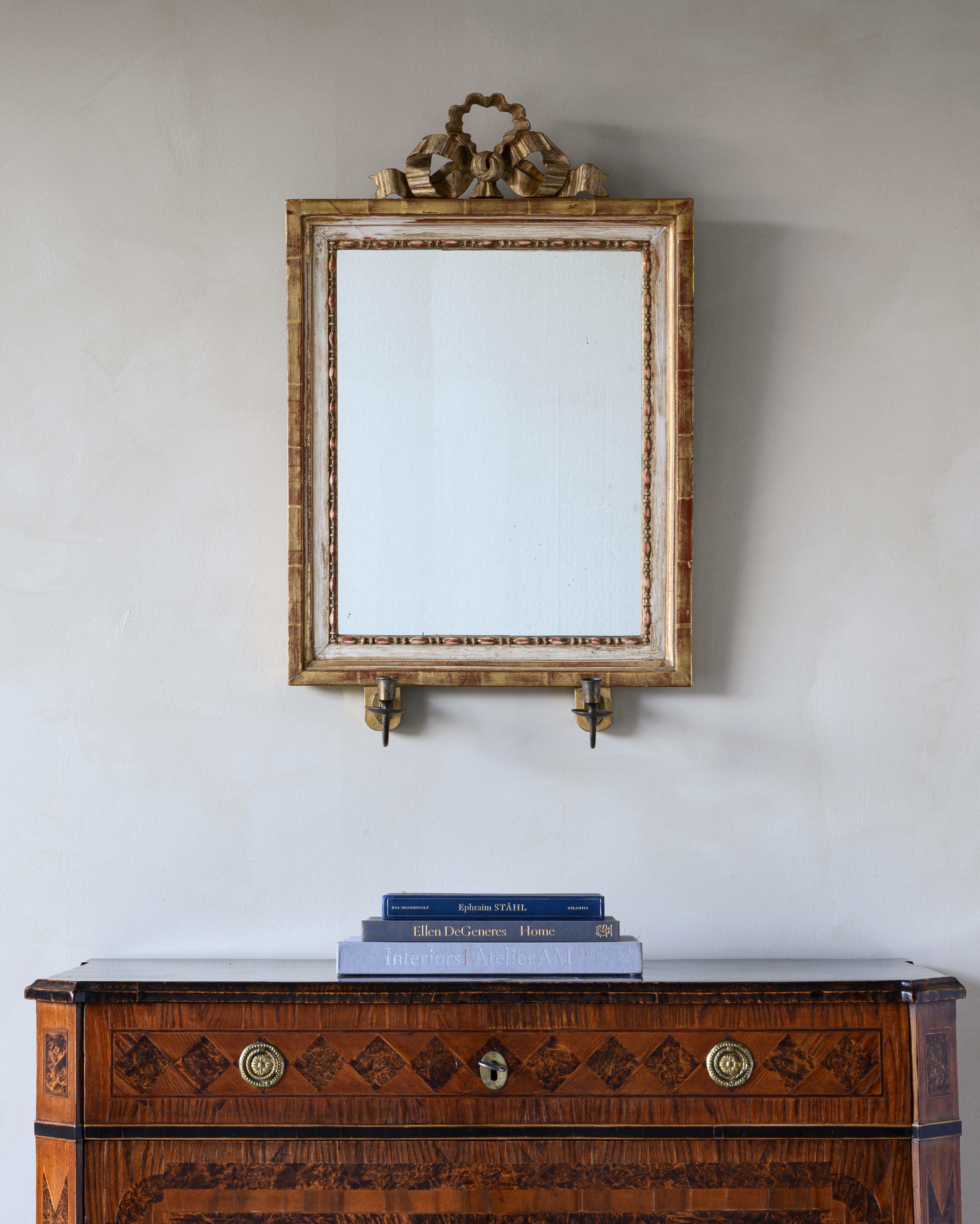 Charming 19th century Gustavian mirror scone with two candleholders, the top carving is removable, circa 1810.