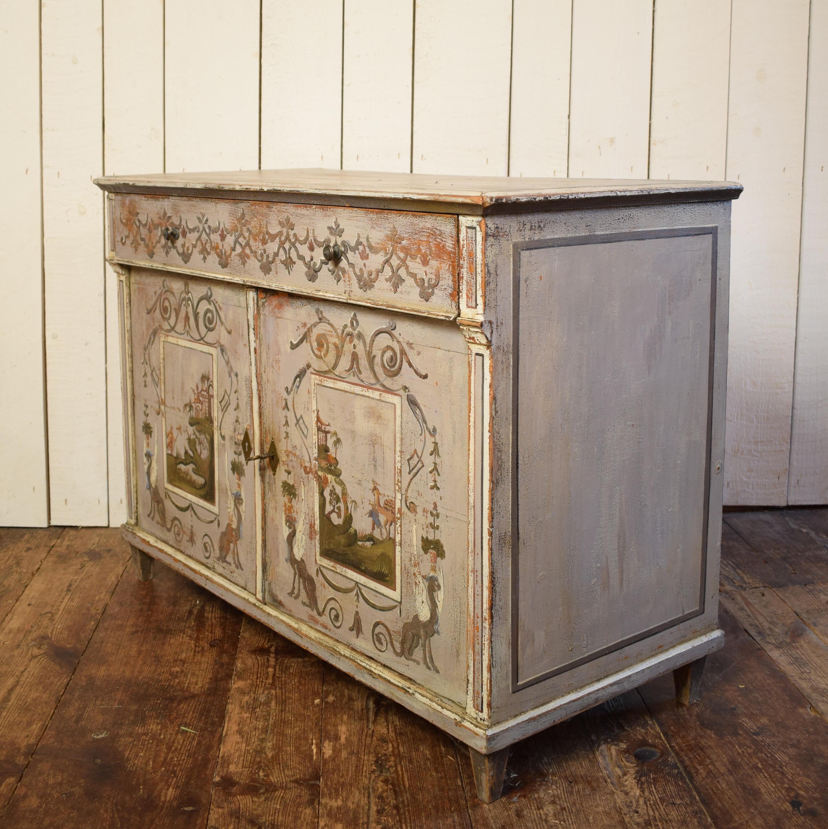 This 19th century pine cupboard is painted with figural and Chinese themes.
It is the original surface and the painting has very beautiful details.
The cupboard has one drawer and two doors. Inside it has some blue paint. A very lovely and