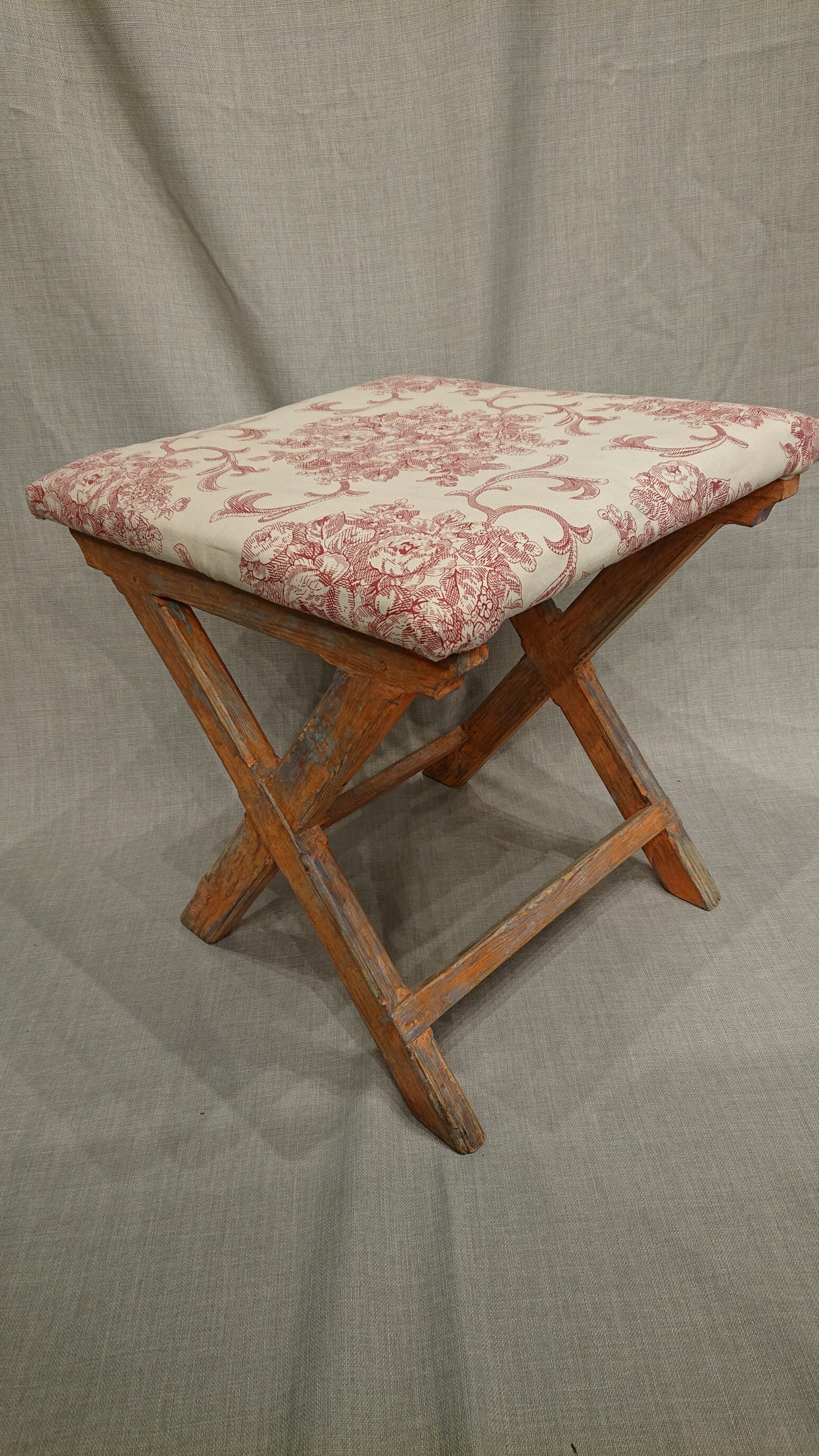 19th century Swedish Folk Art stool from Umea Vasterbotten, Northern Sweden.
A very charming stool. 
The Stool`s seat is made of wood but is upholstered in a beautiful fabric.
Scraped by hand to its original paint.
Made in painted pine.
  