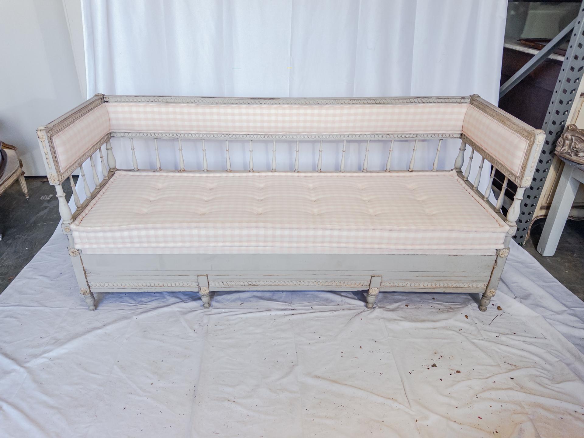 In the opulent world of 19th-century Swedish design, the Gustavian style painted sofa stands as an epitome of elegance and craftsmanship. This magnificent piece, born in the heart of Sweden, boasts delicately carved borders that speak volumes of its