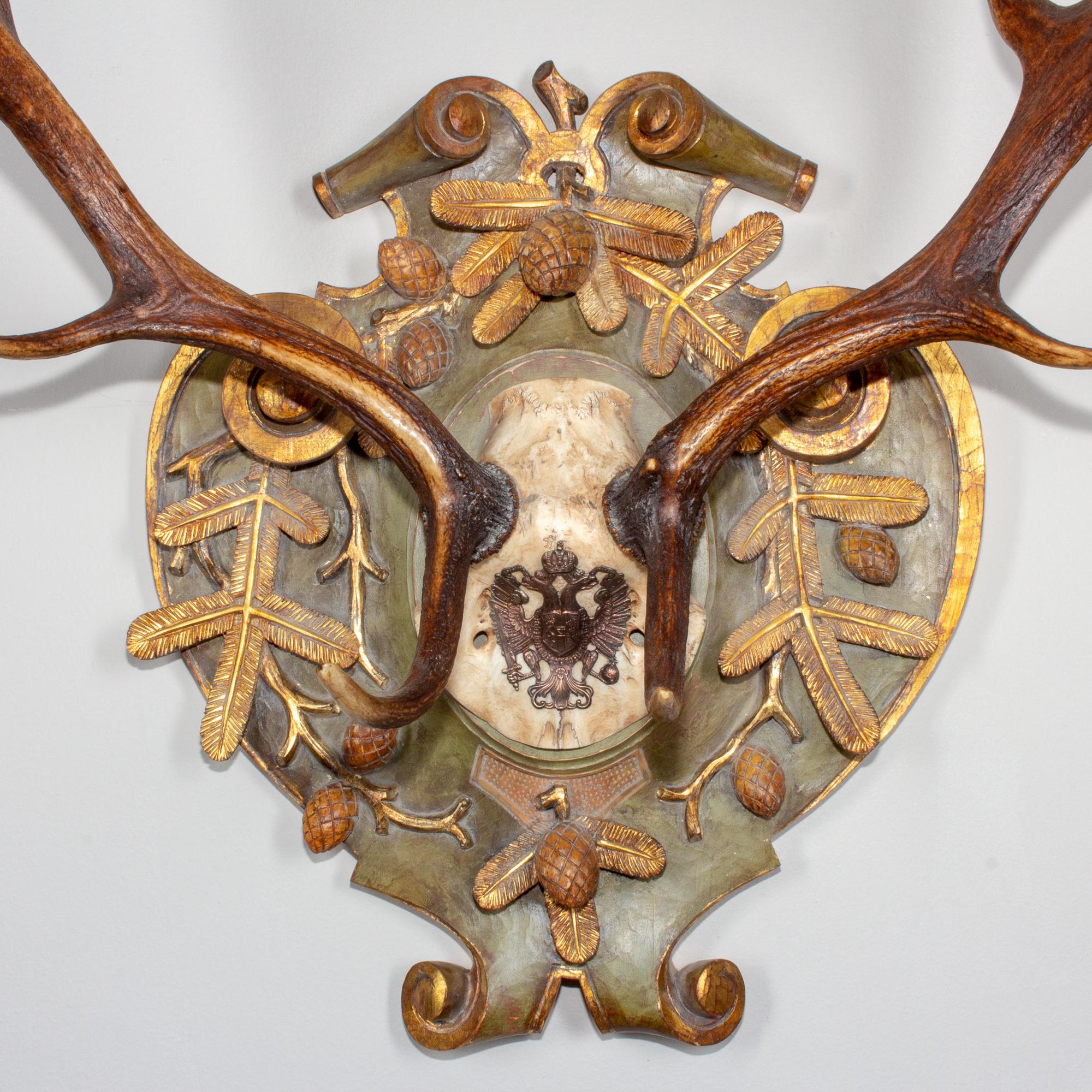 19th century fallow deer from Emperor Franz Josef's castle at Eckartsau in the Southern Austrian Alps, a favorite hunting schloss of the Habsburg Royal family. This historic hunting trophy features a replacement hand-carved linden wood plaque with