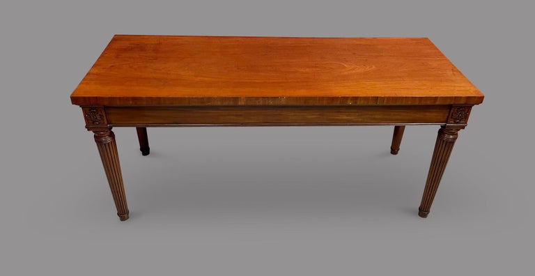 Mahogany 19th Century in George III style, with rectangular top over a plain freize with floral paterea on each tapering reeded leg.
Condition : Very Good
Materials : Mahogany
Origin : English
Manufacture Date : 19th Century