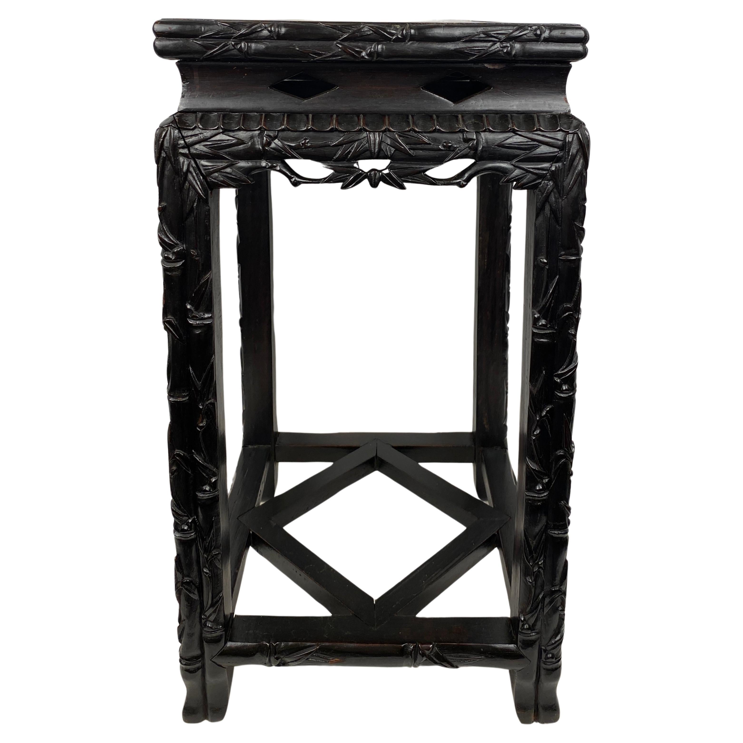 A good quality, hand-crafted 19th Century Chinese end table or side table. Interesting and intricately hand-carved frame. Made from rosewood which give this end table a wonderful antique flair. 

This 19th Century Chinese end table will enhance any
