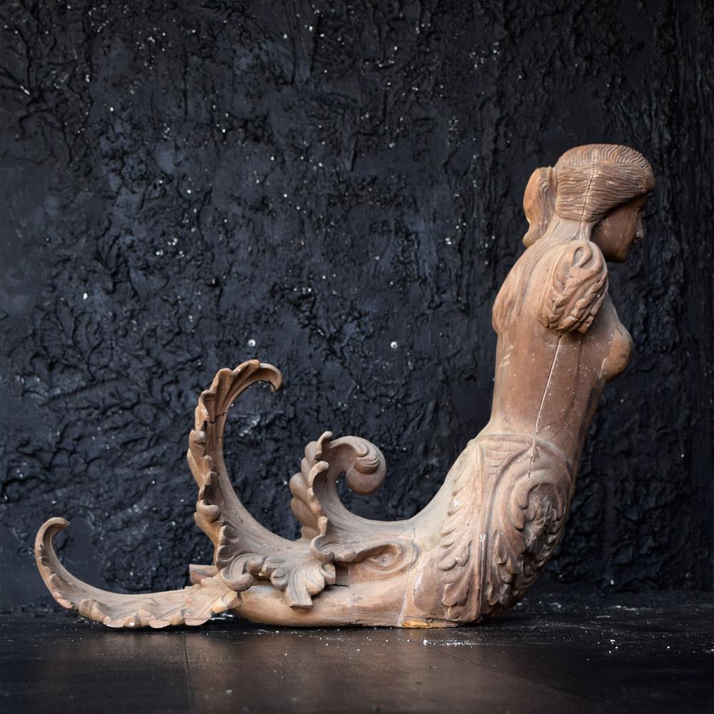 A pair of late 19th century hand carved pine section constructed mermaid figures. Recently uncovered in a stately home sale. These architectural fragments would have been placed at the main entrance hallway to present a truly elegant statement. The