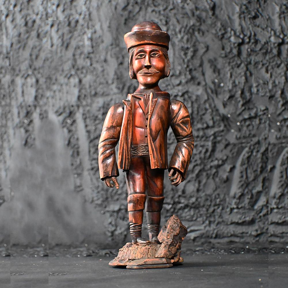 19th Century Hand Carved Folk Art Tyrolean Figure 

A lovely example of a mid-19th Century folk art hand carved Tyrolean (Austrian) figure of a man with moveable arms.  A wonderful naturally aged patina with beaded eyes. Handwritten ink label at the