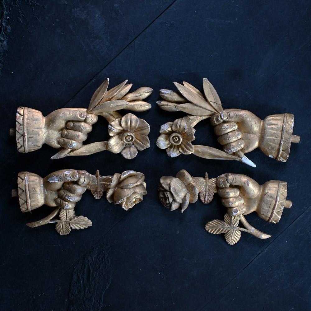 19th Century hand carved gesso over pine curtain pole ends.

2 pairs of mid-19th Century hand carved gold gilt gesso over pine highly decorative French curtain pole ends. Detailing hands holding roses and flowers with foliage. These items have brass