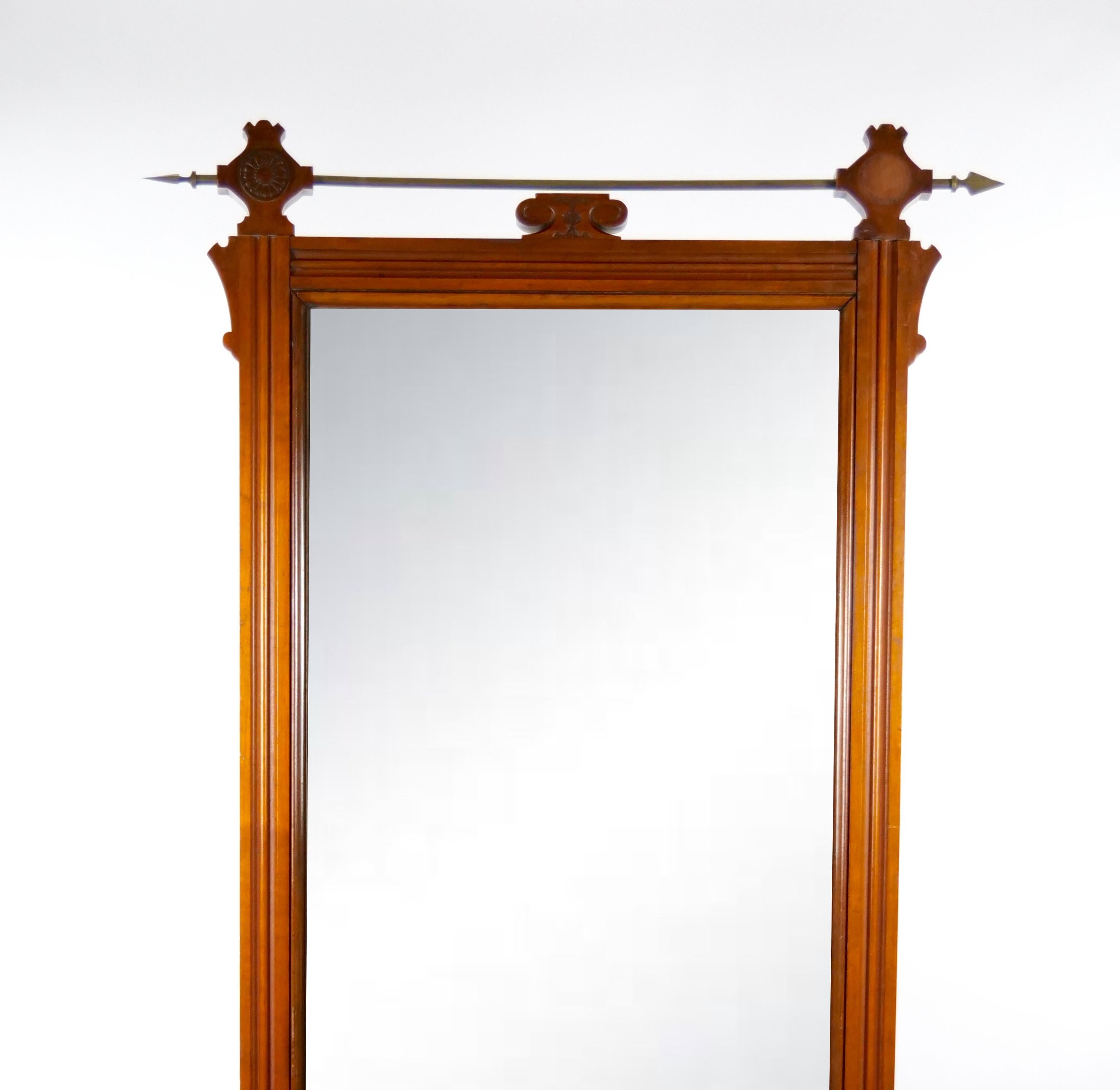 
Step into a world of refined elegance with our extraordinary antique  hand carved mahogany wood framed adorned with exquisite gilt brass design details. This remarkable hanging wall mirror embodies the timeless craftsmanship of the bygone era,