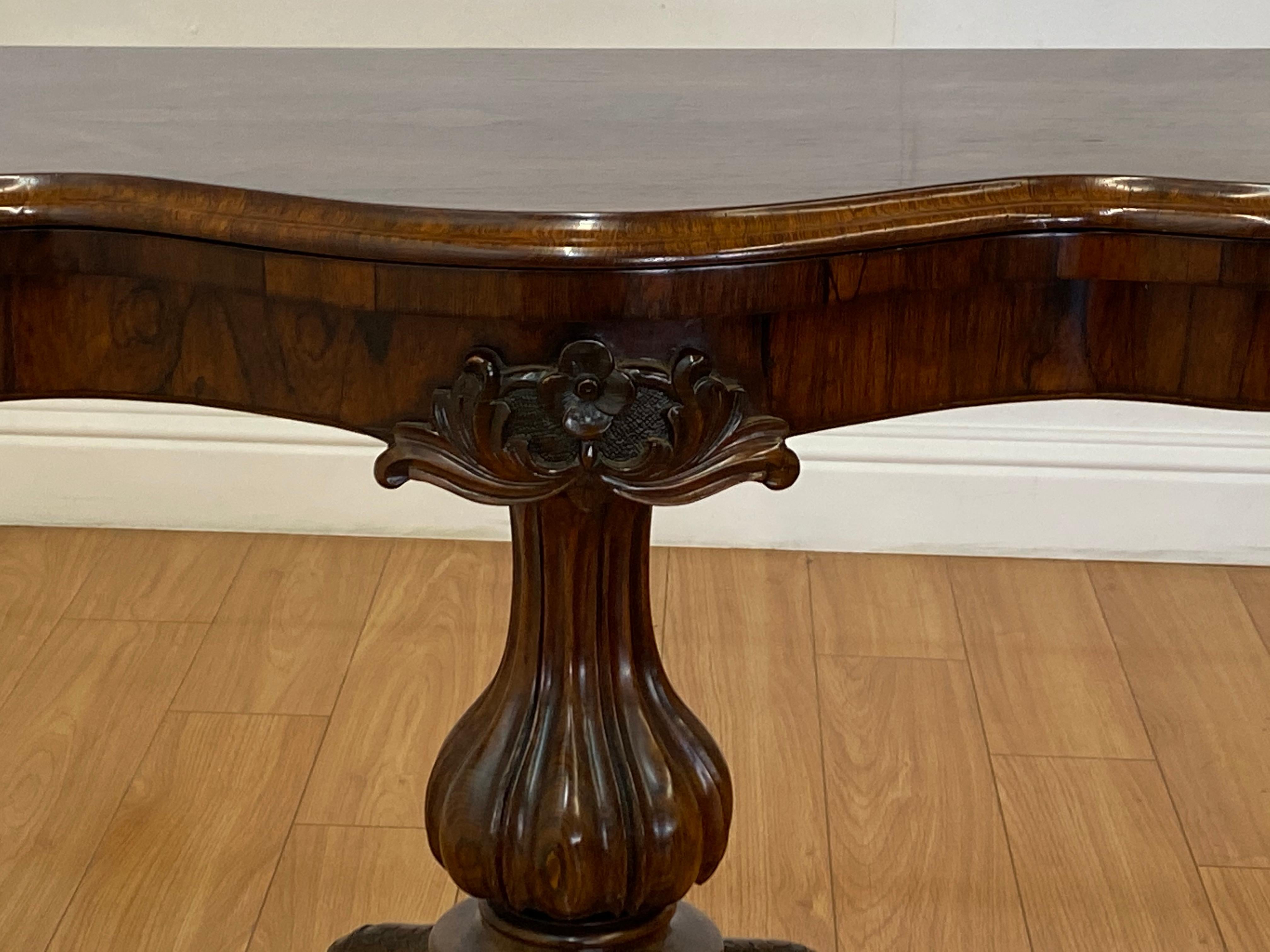 19th century hand carved rosewood console / games table c.1880

Handsome hand carved rosewood console that pivots and flips into a games table

A newer faux leather games table surface has been added (as found )

The gorgeous hand carved