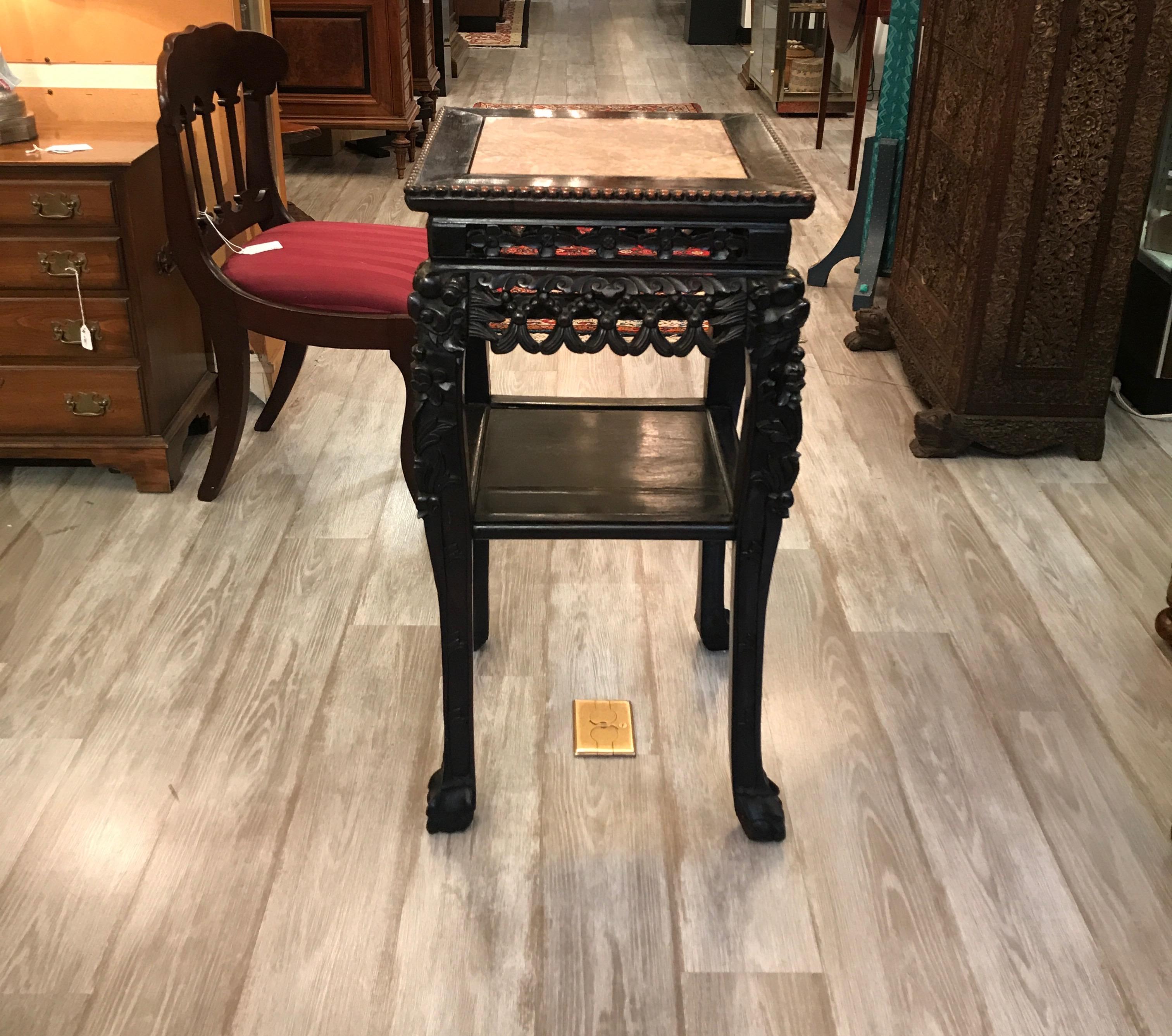 Beautifully carved hardwood square stand with marble top. Carved rosewood with a figurative rouge marble top with lower shelf. Perfect accent piece or for use as a stand for sculpture or porcelain objects.
