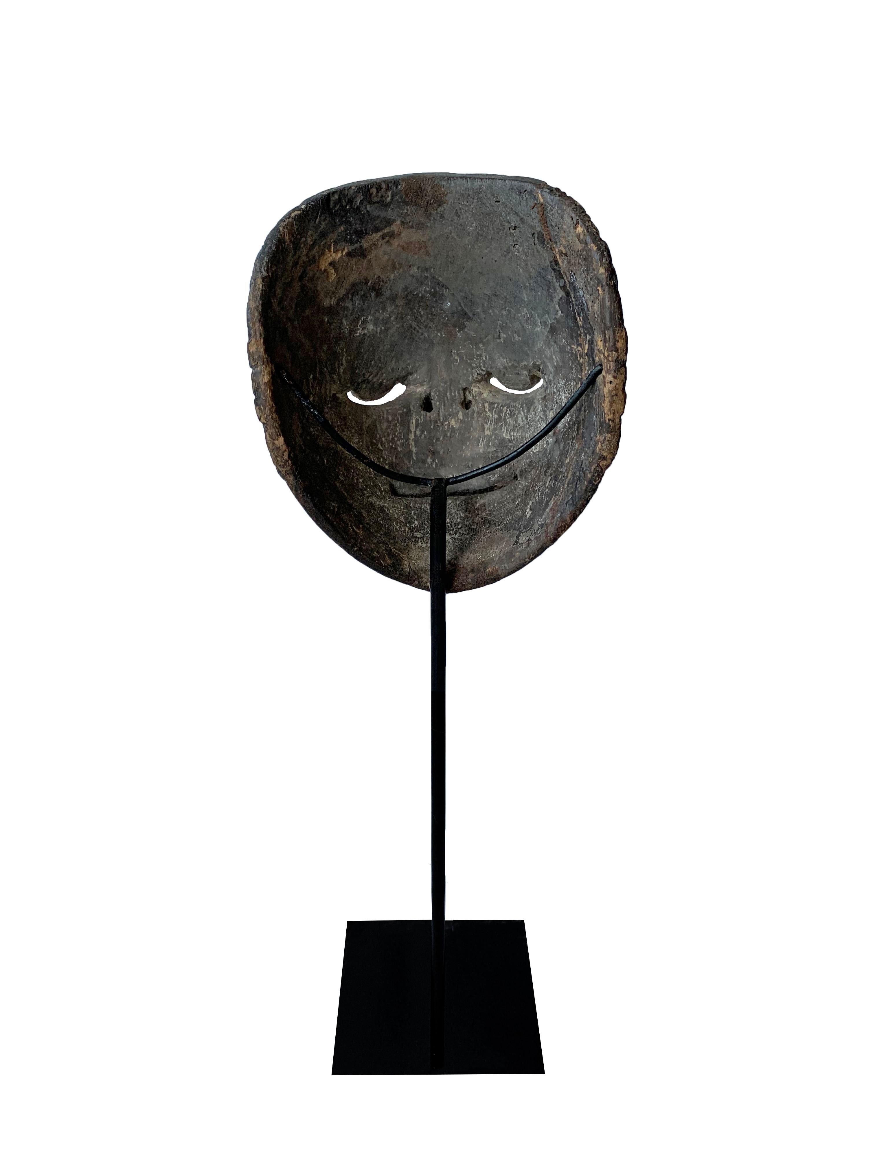 indonesian wooden mask and sculpture