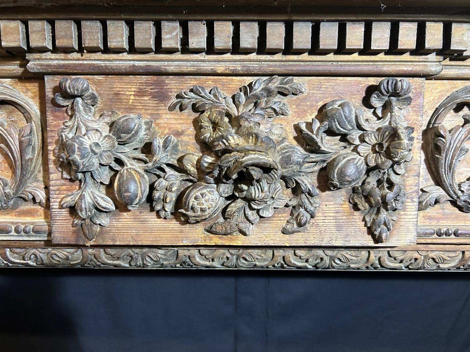 Hand-Carved 19th Century Hand carved wooden Fireplace For Sale