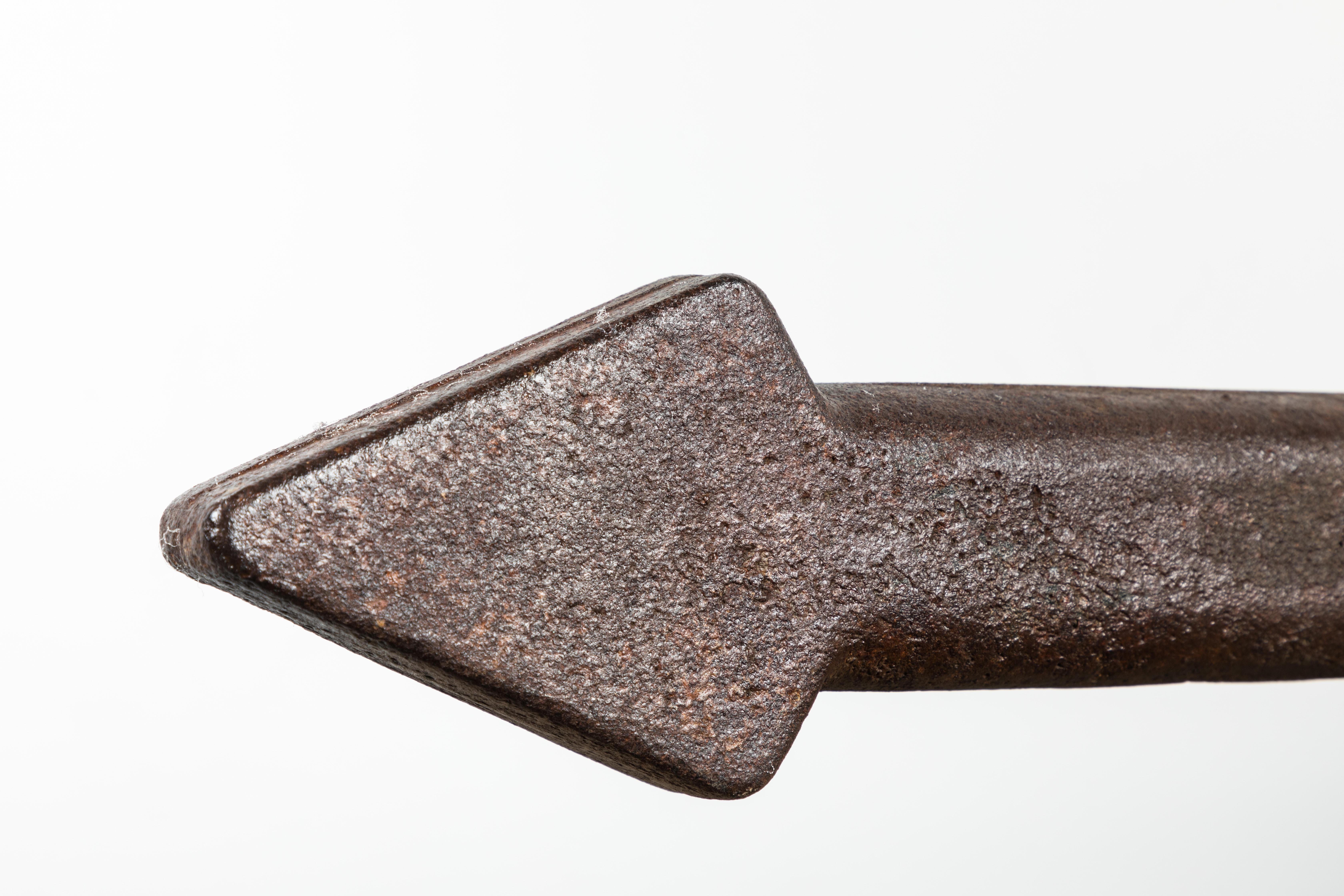 Fantastic chunky 19th century hand-forged iron arrow. Great shelf decoration. Could be wall mounted. Very solid piece.