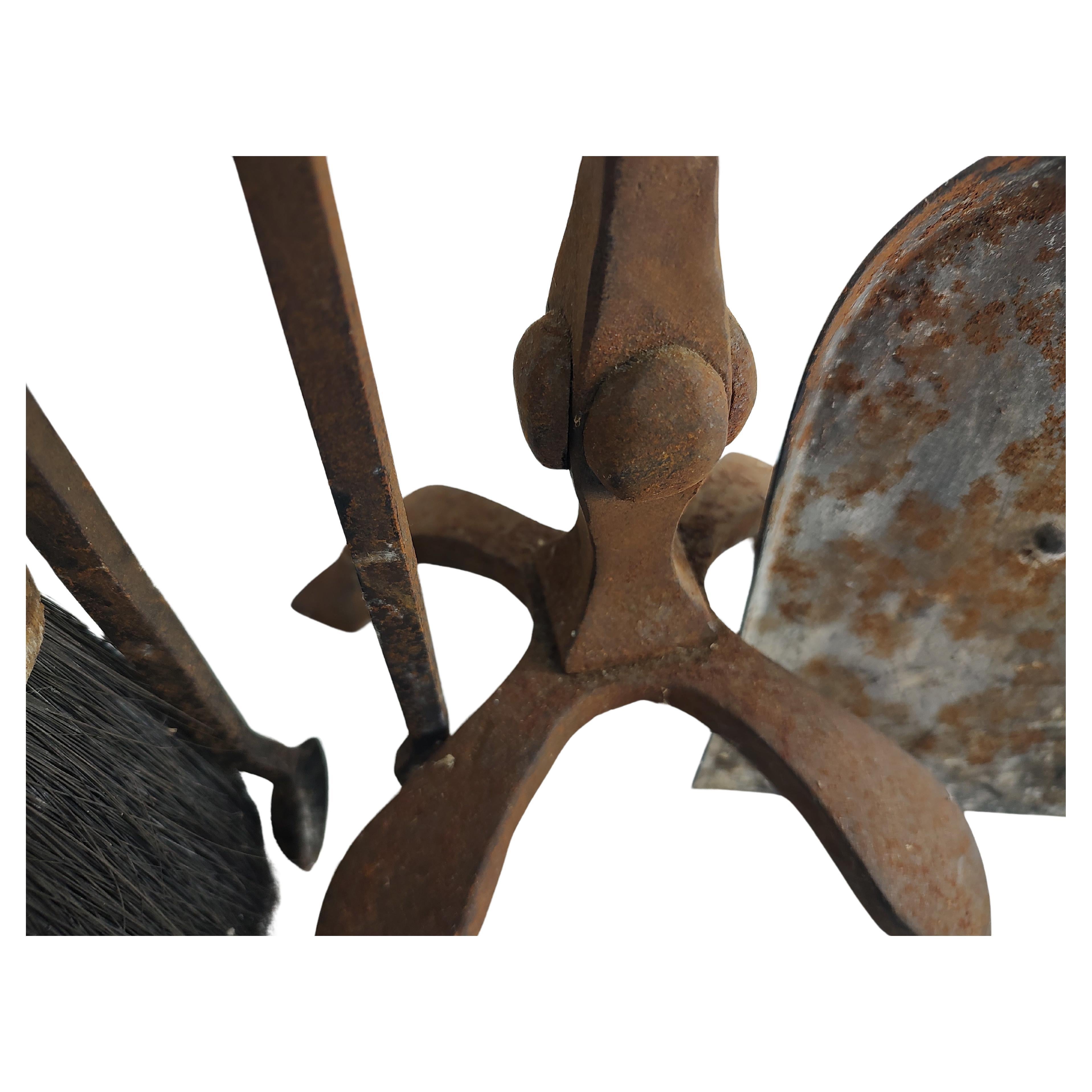 Fabulous set of hand forged fireplace tools with holder. Shovel, log clamp and brush with original holder all with tons of patina. Will oil and cleanup upon request. 