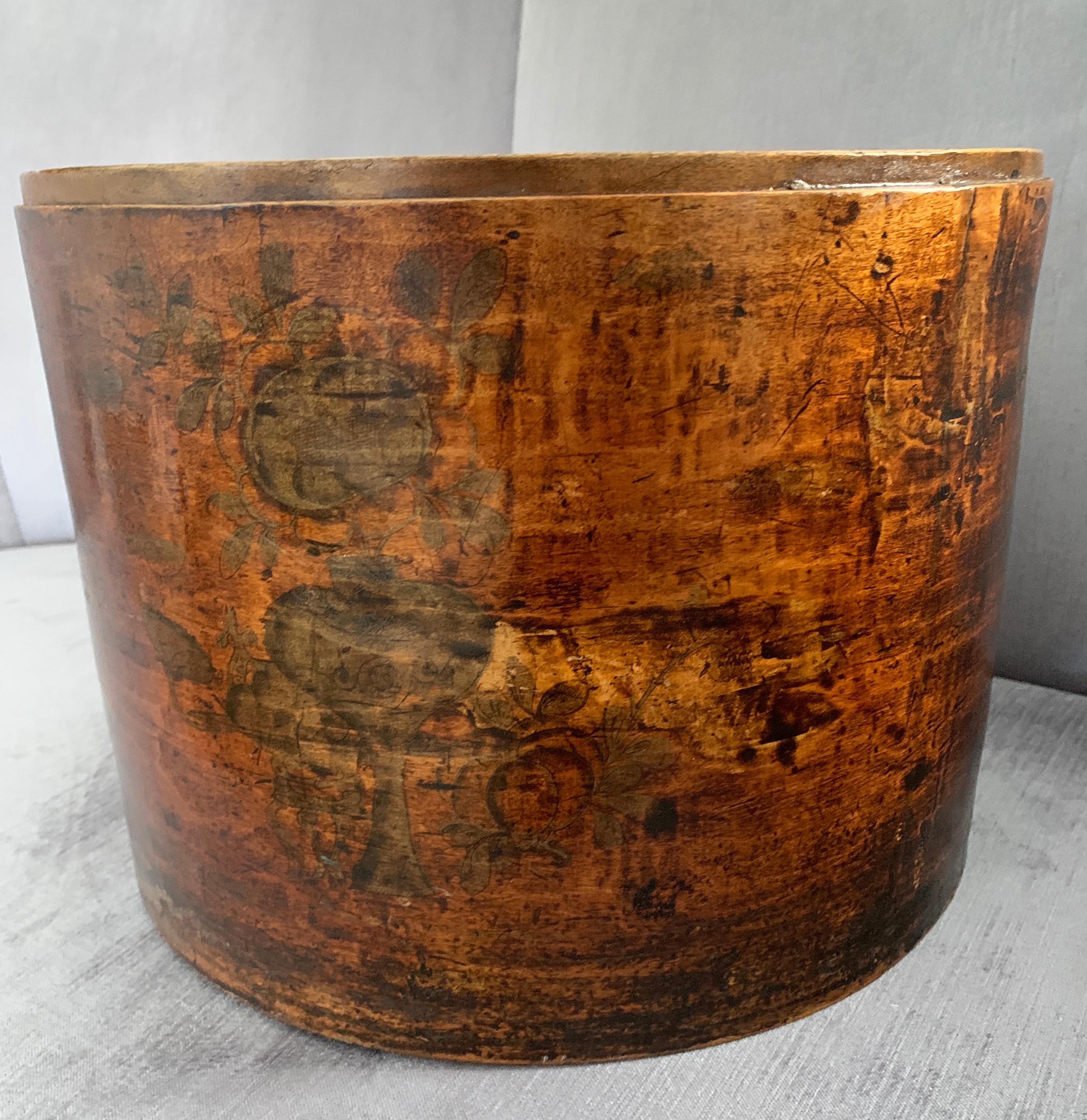 A Chinese wooden hat box - handmade, with a chinoiserie image. The box is in very good condition with fitted top, the wood is a wonderful patinated color. A complimentary decor to any shelf and great storage box, from love letters to sewing