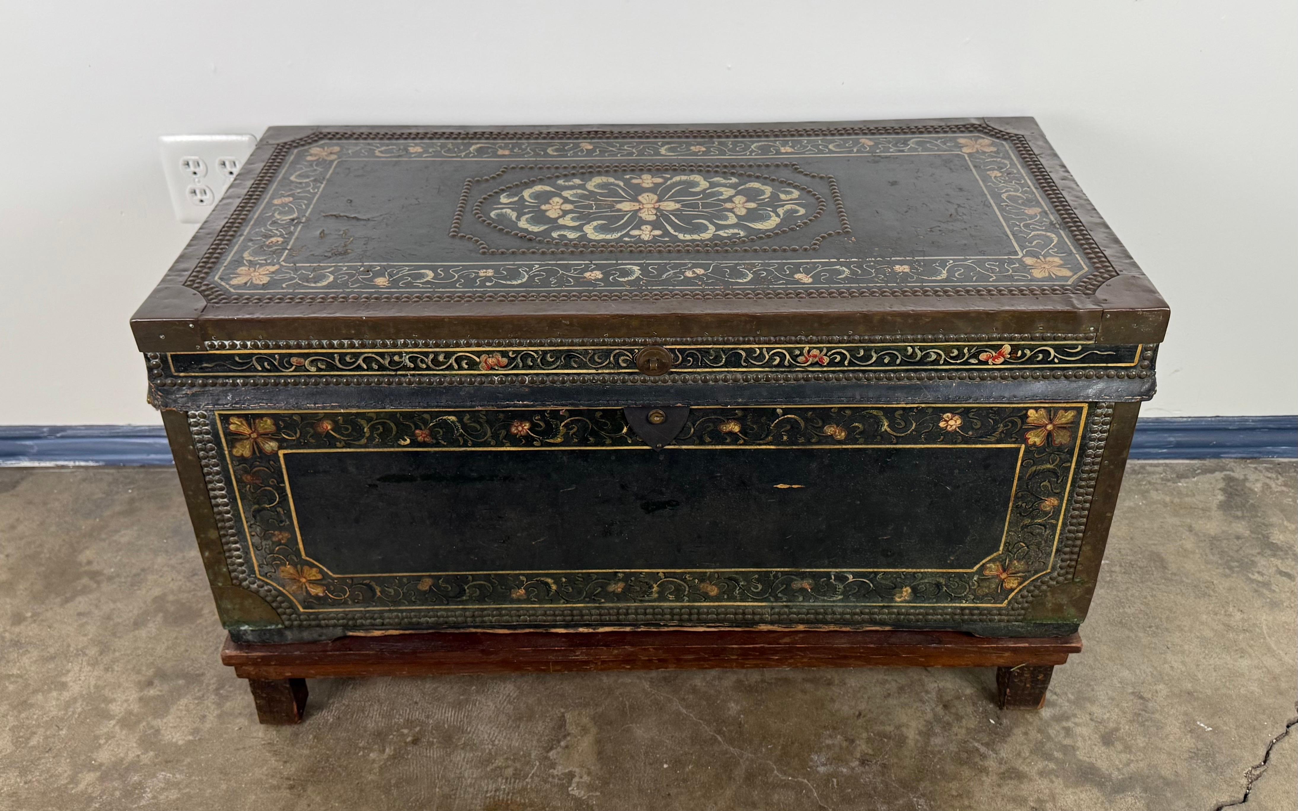 An exceptional 19th century hand-painted American immigrant trunk bearing the name Henry A. Tefft of Racine, Wisconsin, richly decorated in a folk-art floral motif. This rare survivor is a beautiful example of immigrant craftsmanship and personal
