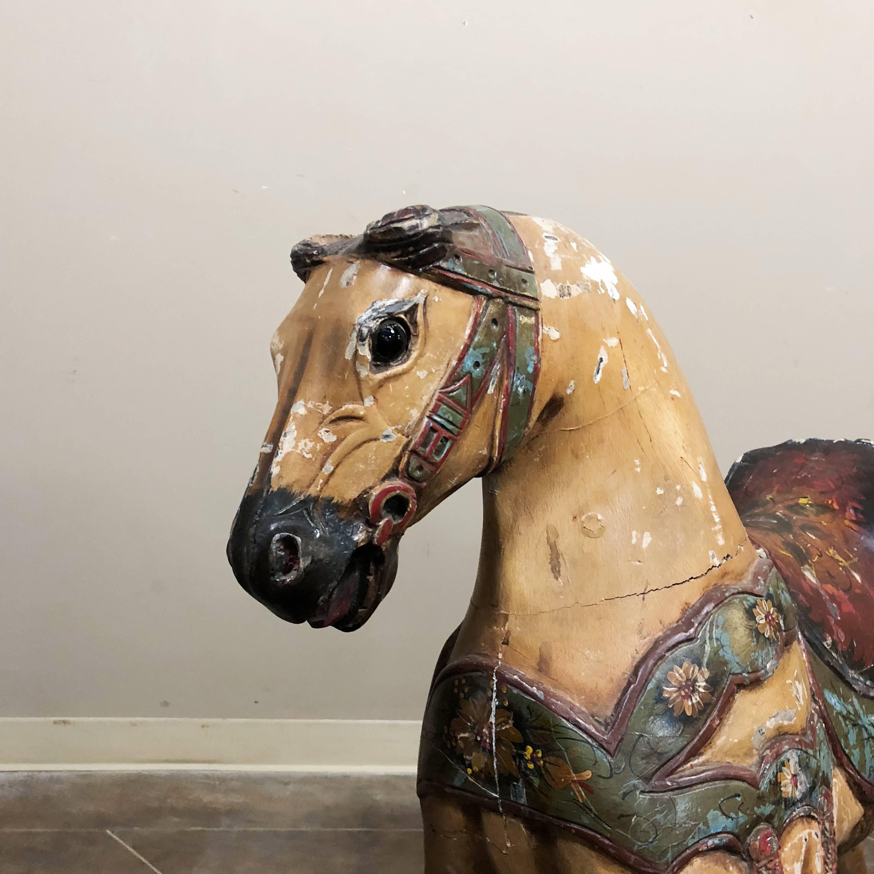 Vintage hand-painted Carousel horse is a remarkable reminder of a bygone era, when travelling carnivals enthralled rural populaces with dazzling lights, mechanized rides and a fascinating source of imagination! This example is a splendid rendition