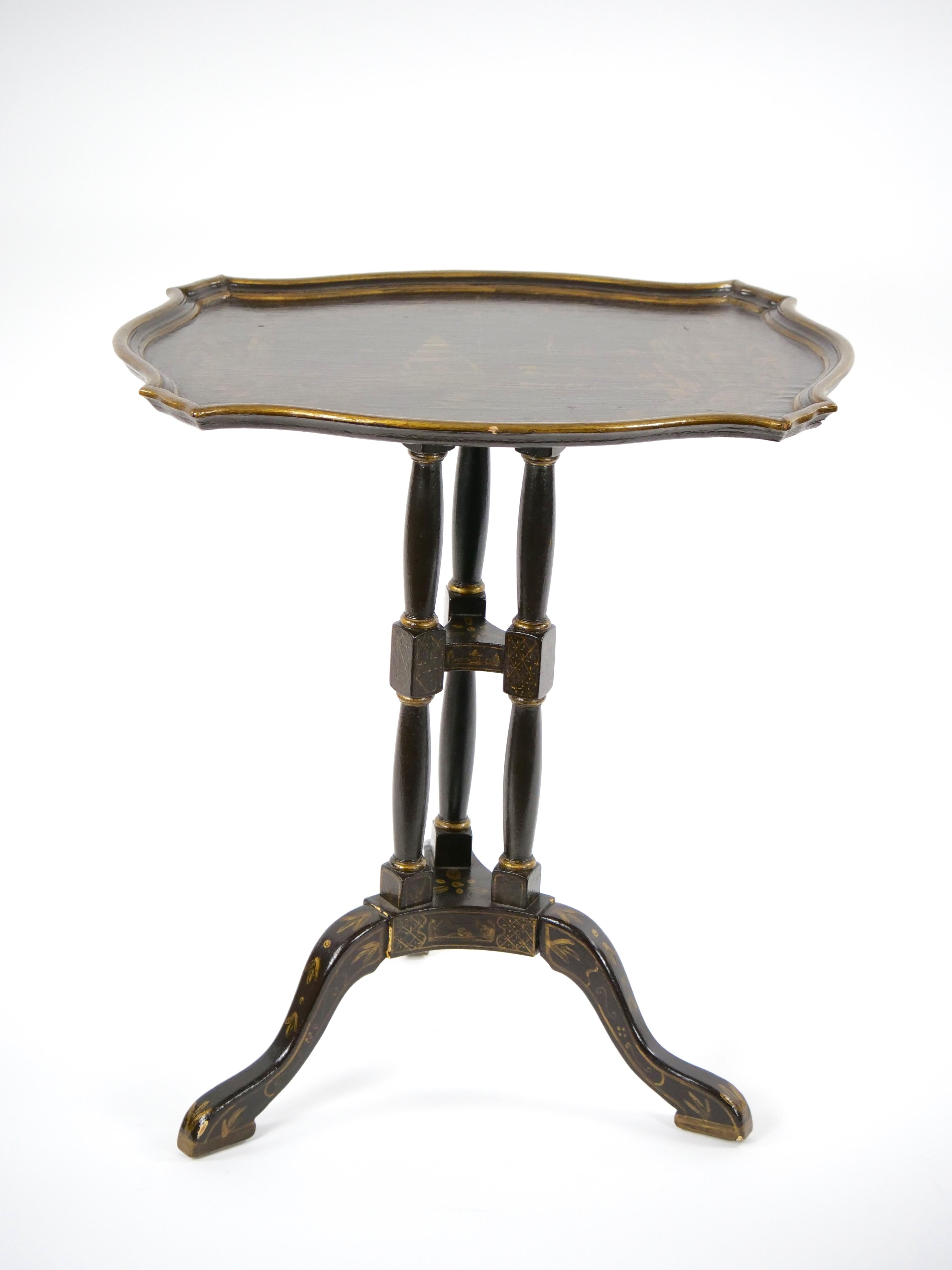 
Elevate your living space with the timeless charm of our 19th century Victorian tripod side table, a true embodiment of the era's elegance and artistry. This exquisite piece is hand -painted and adorned with captivating chinoiserie designs that
