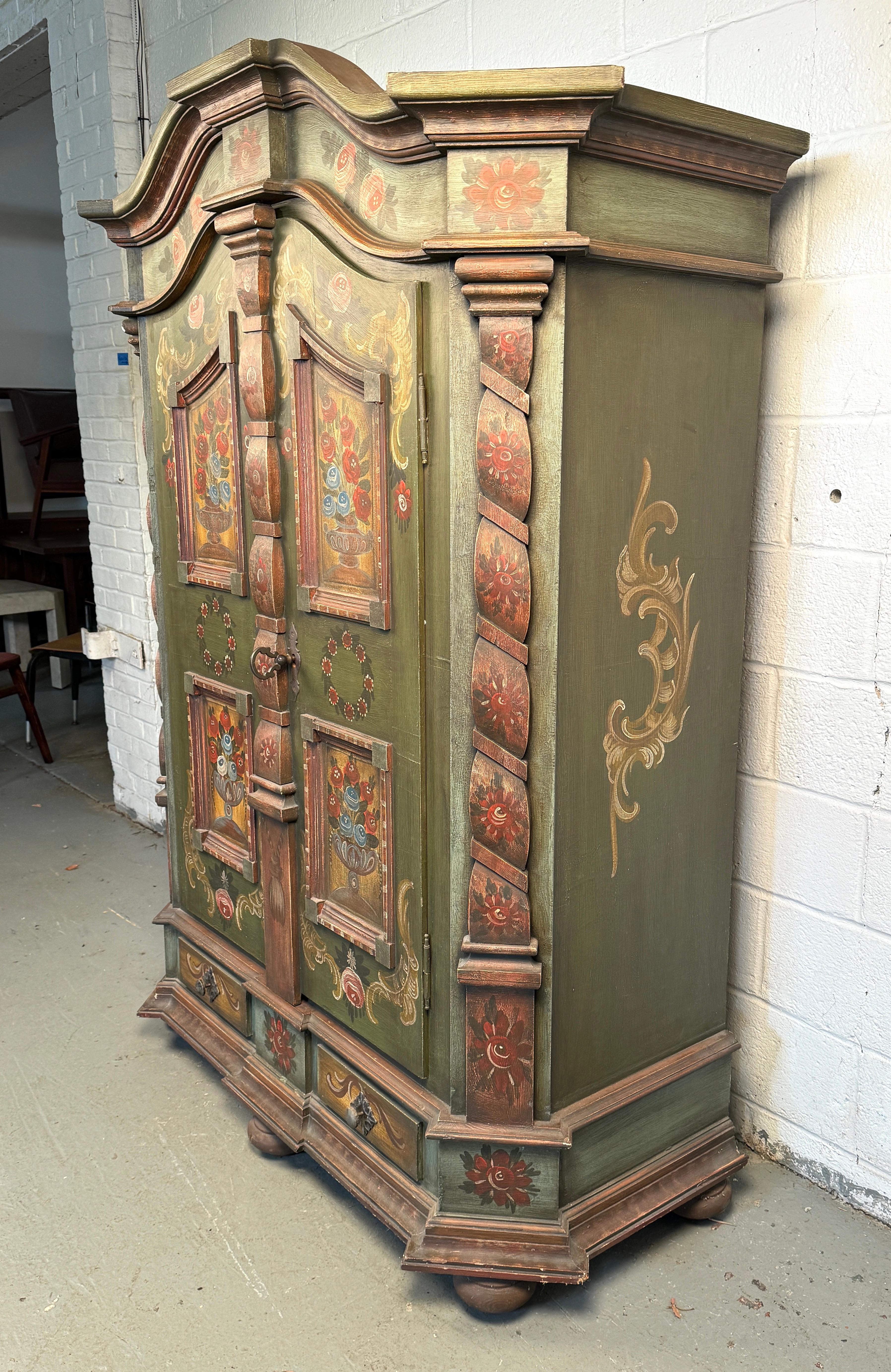Step into the world of vintage charm and refined elegance with this exquisite 19th-century hand-painted floral wardrobe. A true testament to artisanal craftsmanship, this wardrobe features delicate, hand-painted floral designs that evoke the grace