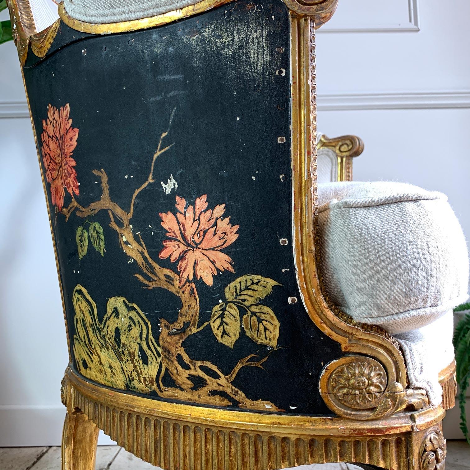 Dating to the 1700’s, this fine, rare chair is highly decorated with finely carved, hand coloured chinoiserie flowers and birds set against a noire background, the scroll arms and tapered legs on scroll feet in gilt, the back framed in gilt gesso