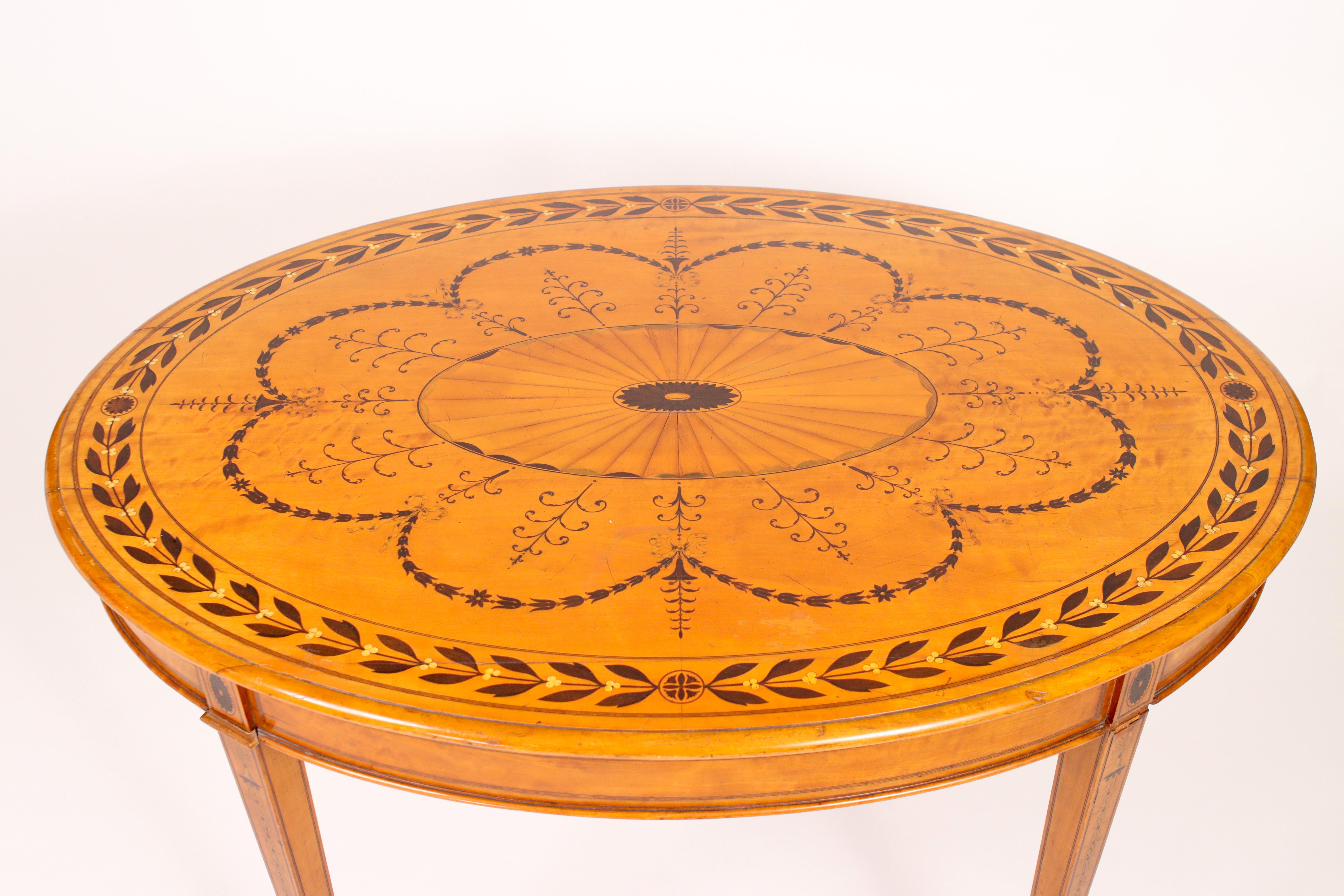 Fine turn of the century oval satinwood
Finely inlaid and hand painted centre table on four legs
All with original brass casters

18th century to the 1900s.

Hand painted, light brown satinwood European and Victorian oval centre table.