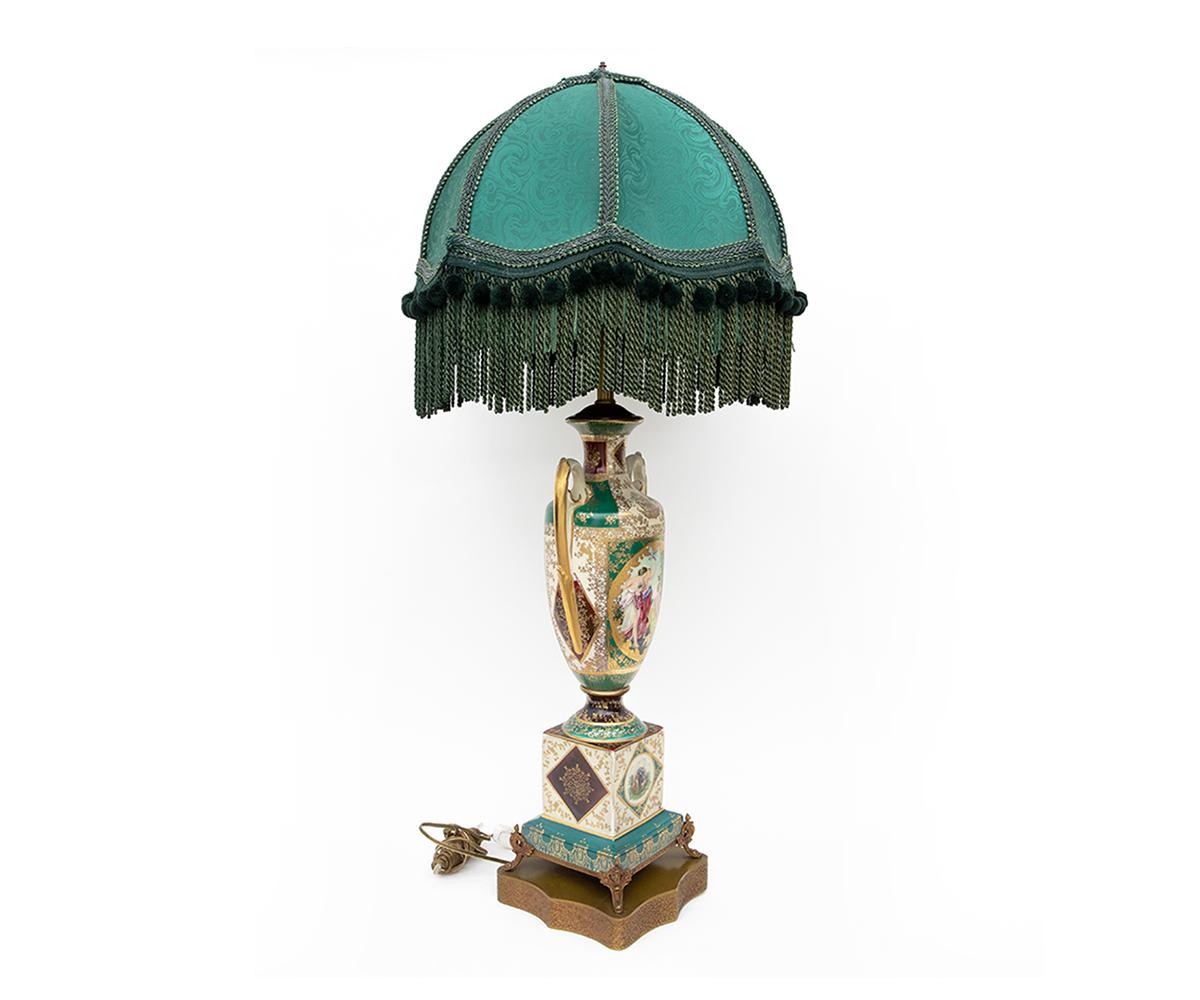 Offered is this fine 19th century converted antique Royal Vienna lamp hand painted, parcel-gilt with two handle urn. It features an elaborate green color rounded large bullion shade with a breathtaking hand painted portrait on a porcelain