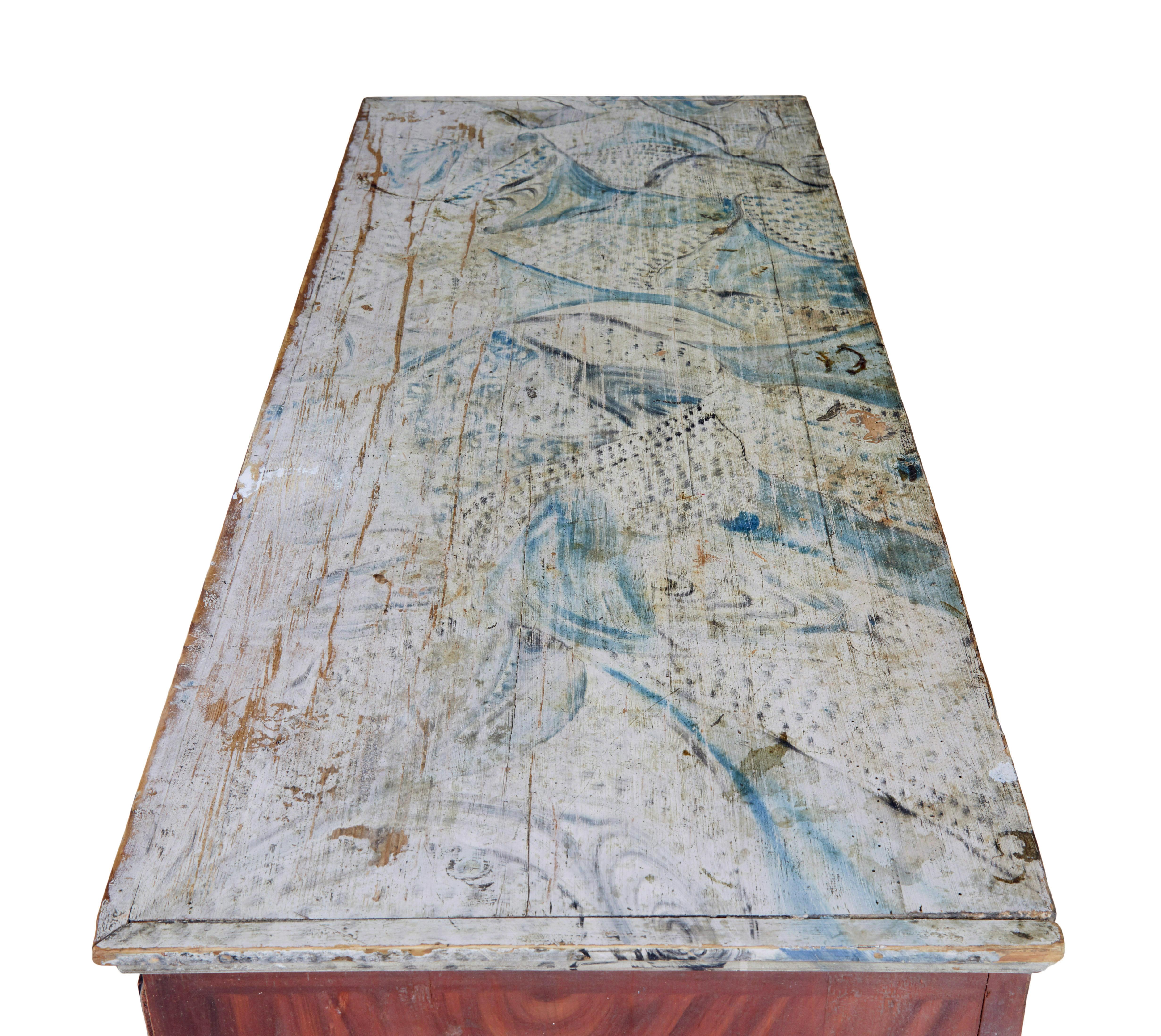 19th century hand painted Swedish chest of drawers circa 1840.

Good quality Swedish commode, quite possibly from the Dalarna region.

Heavy chest of drawers made from solid thick pine.  Rectangular top with a hand painted blue and green floral