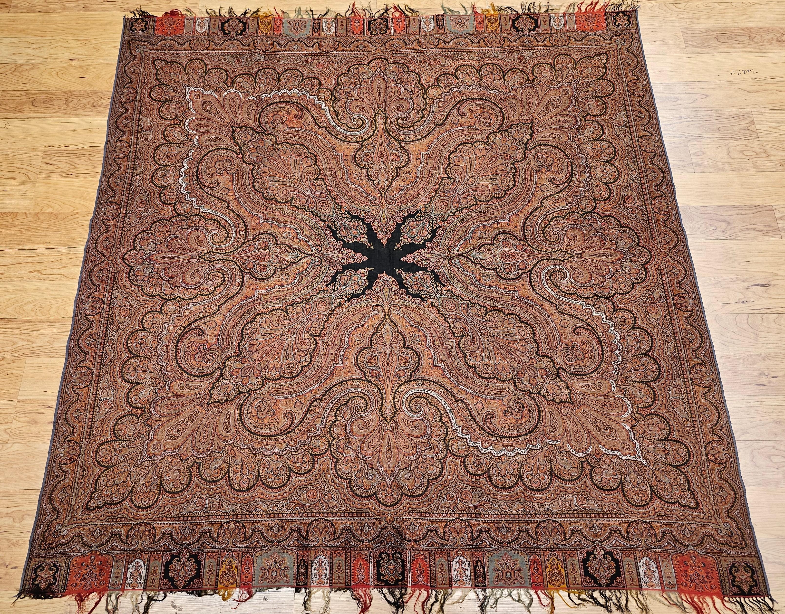  A refined 19th-century hand-woven Paisley shawl from Northwest India, showcasing a sophisticated color palette of brick red, ivory, and black. Crafted in the Kashmir region, this historic textile represents the pinnacle of Indian weaving traditions
