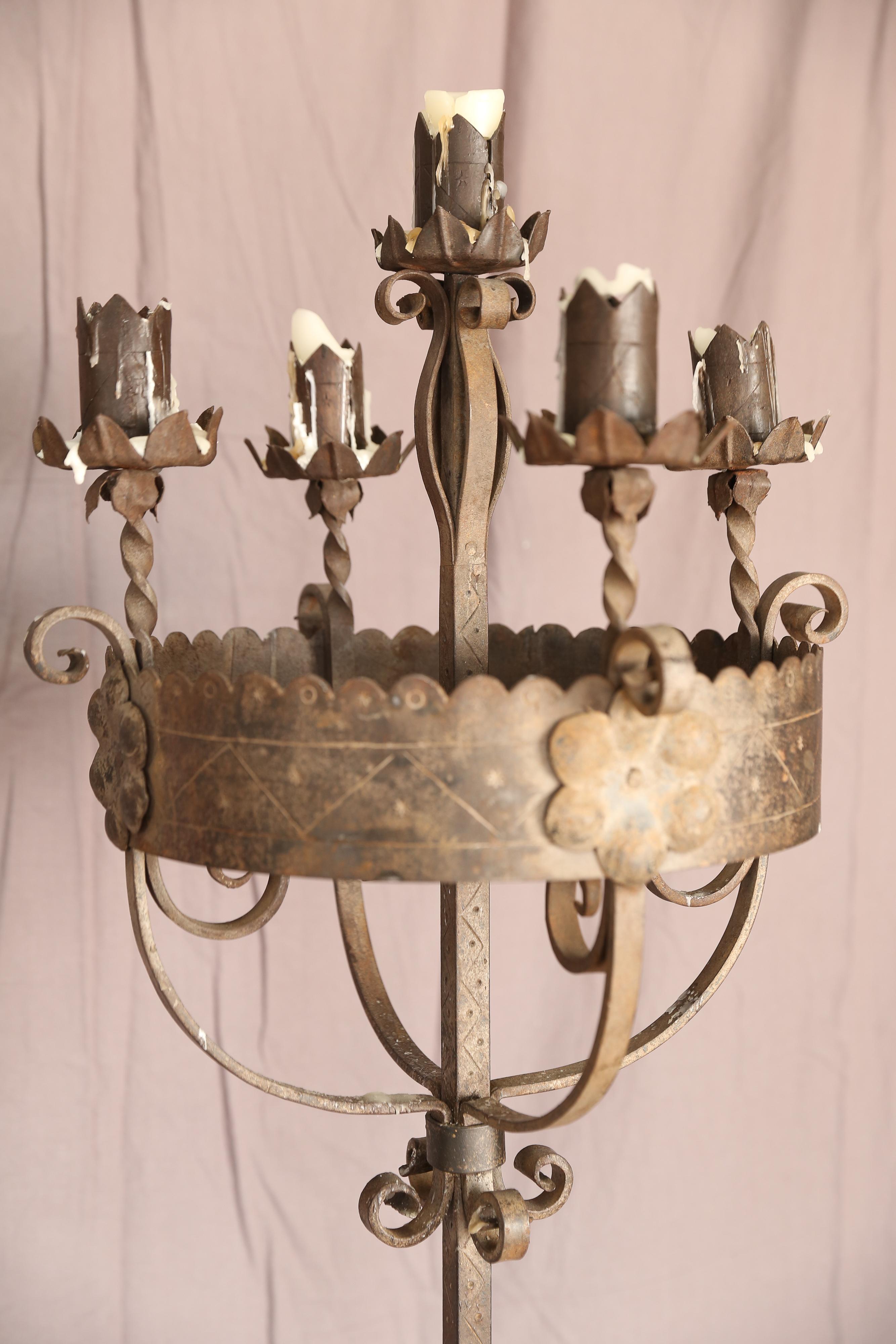 19th century hand -wrought iron candlestick. A replica of this style was made in 2000 to flank this one.