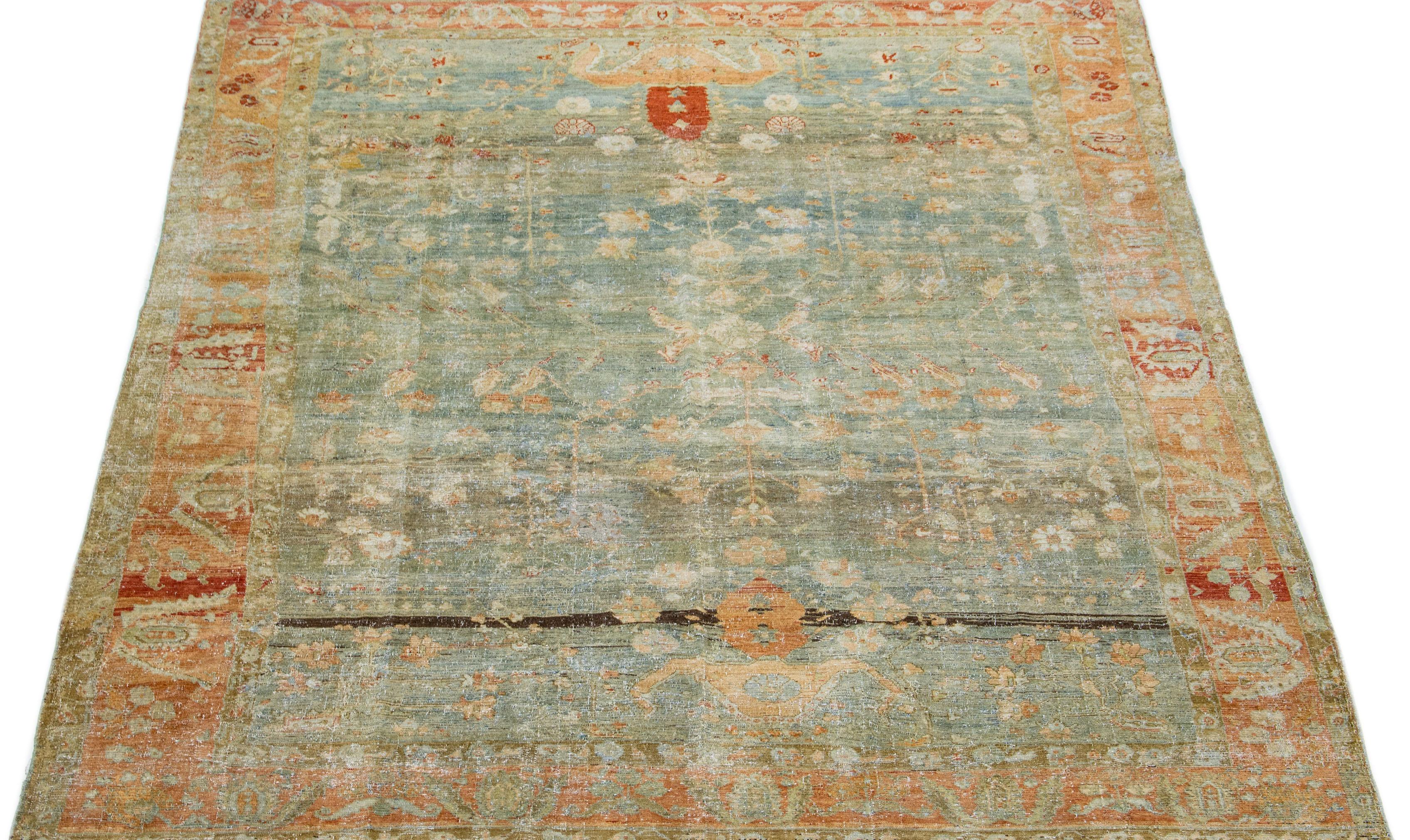 Magnifique tapis ancien Malayer en laine nouée à la main avec un champ de couleur bleu. Ce tapis persan a des accents rouille et marron dans un magnifique design traditionnel Allover.

Ce tapis mesure 8'9