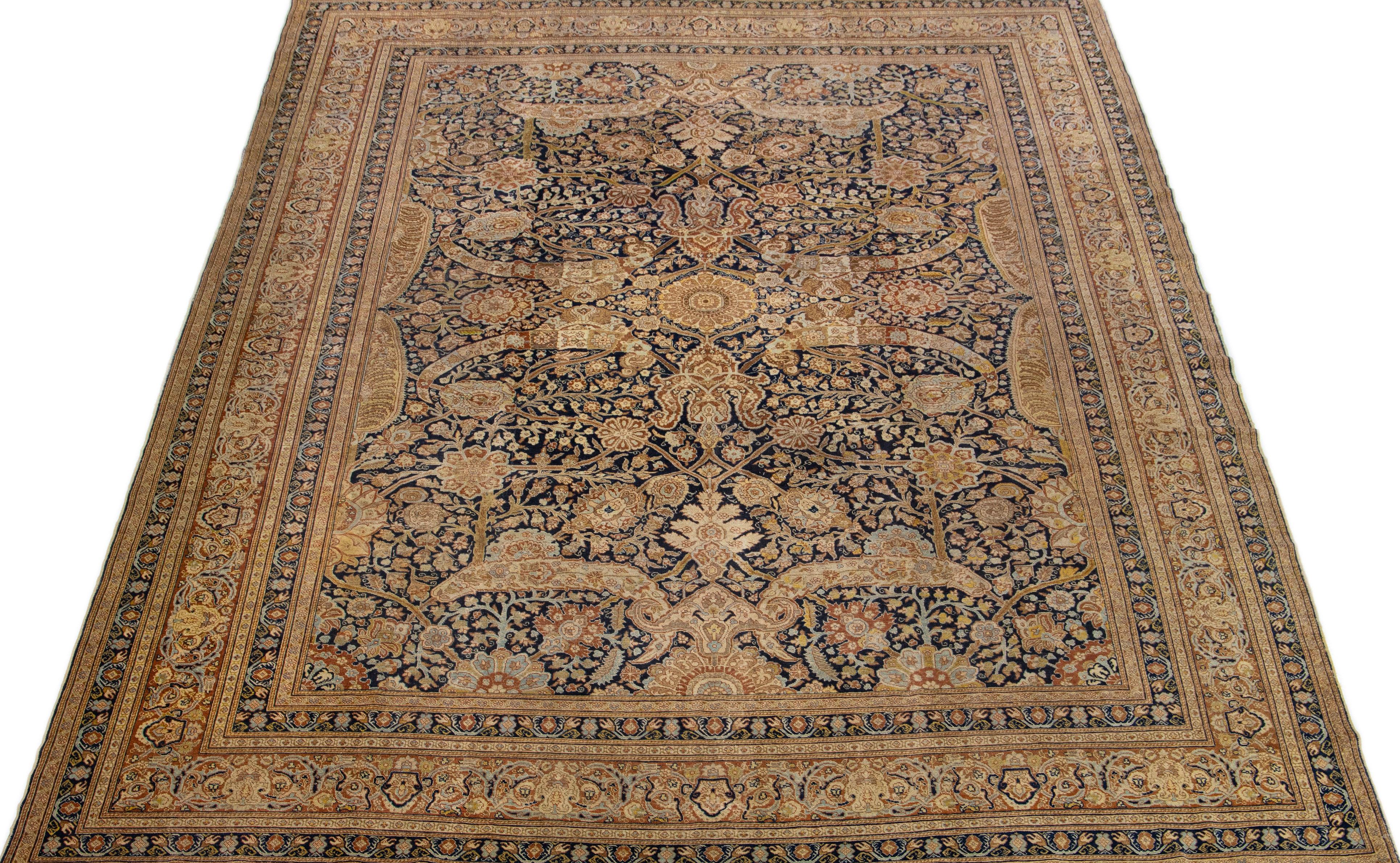 This stunning hand knotted Persian Tabriz wool rug has a beige and blue field with a gorgeous traditional floral medallion design featuring a peach accent. An antique masterpiece, this rug is a magnificent piece of art.

This rug measures 9'4