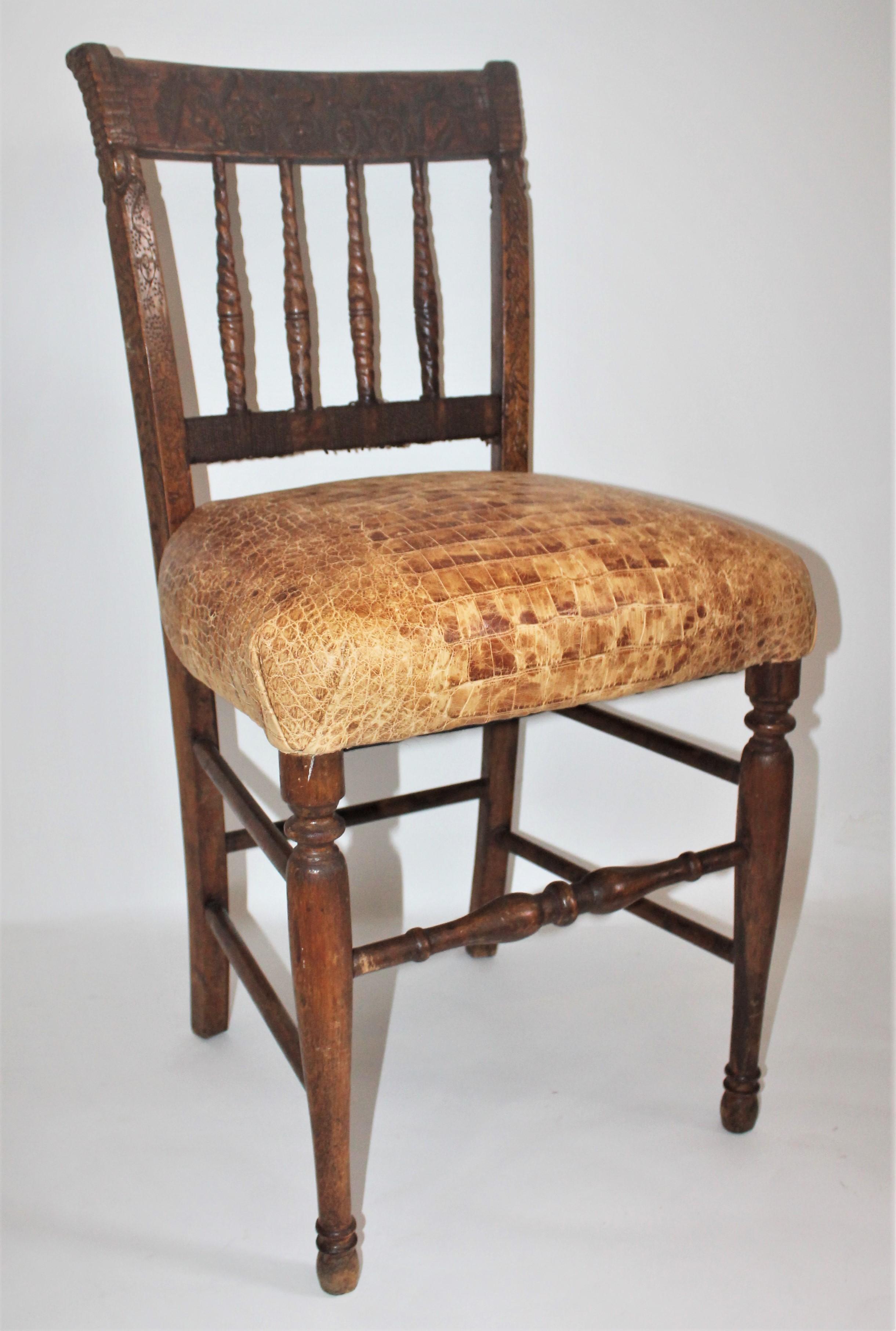 This amazing handmade English chess chair is hand carved. The chair seat is hand webbing made from hemp. The hand carved figurines and hand carved signature are on the top rail of the chair leading down the side rails. The name Langton is recorded