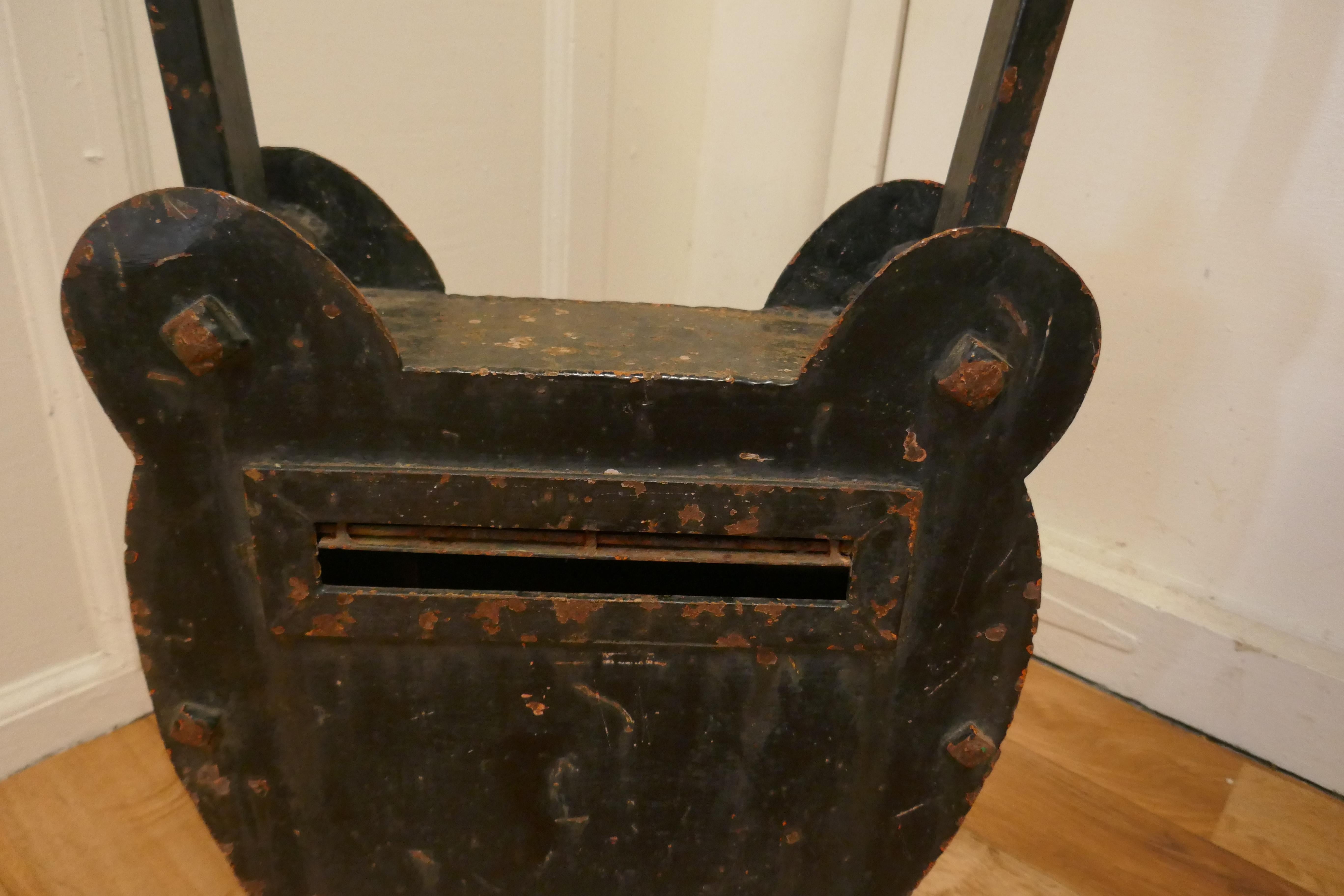 19th Century hardware shop letter box, locksmith.

The Post Box is a very unusual piece, it is blacksmith made to hang outside a Hardware shop, it is in the shape of a padlock
On one side this is a slot for letters and in the other a lockable